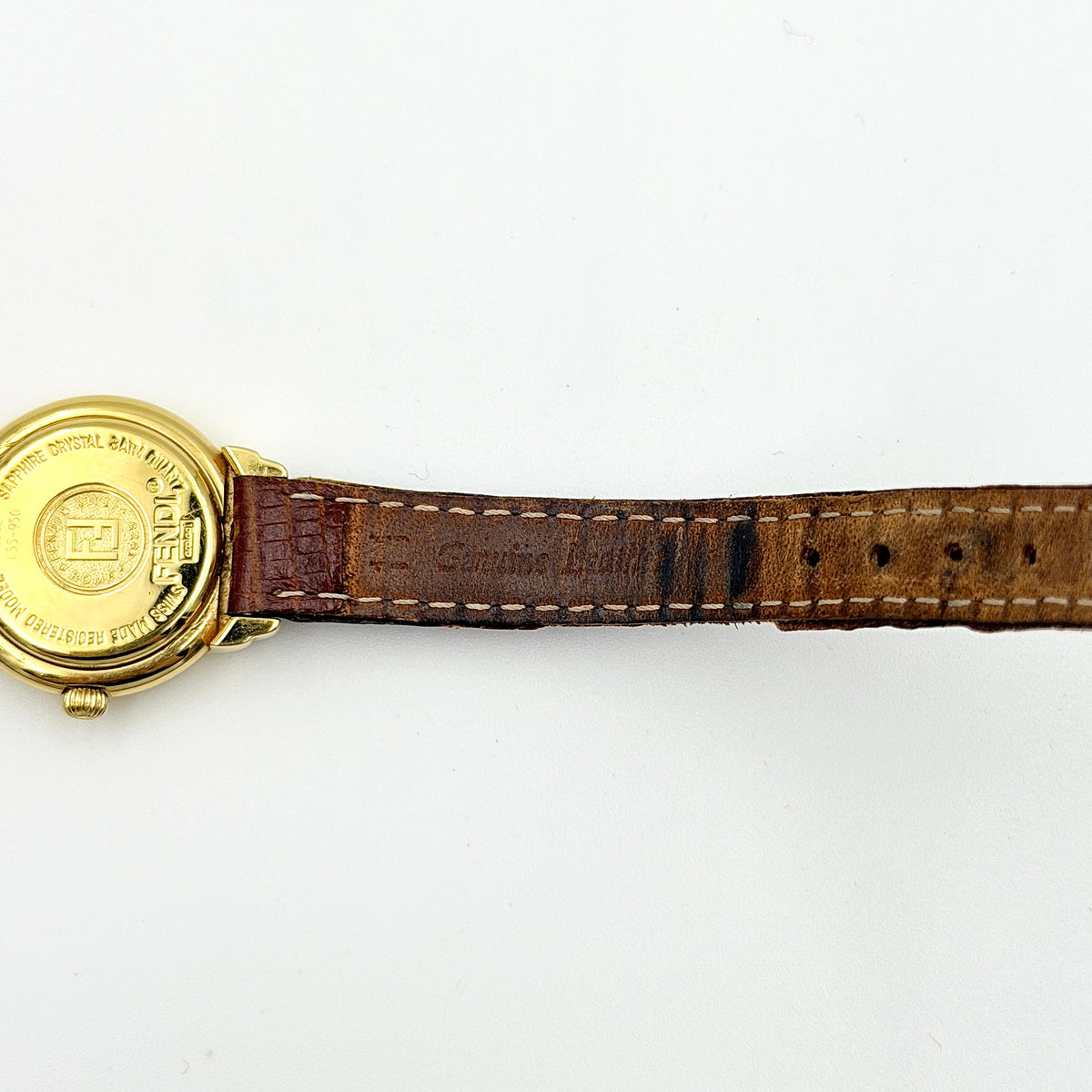 Fendi 350L Orologi Quartz Watch in gold with brown leather strap, displayed with original box and booklet.