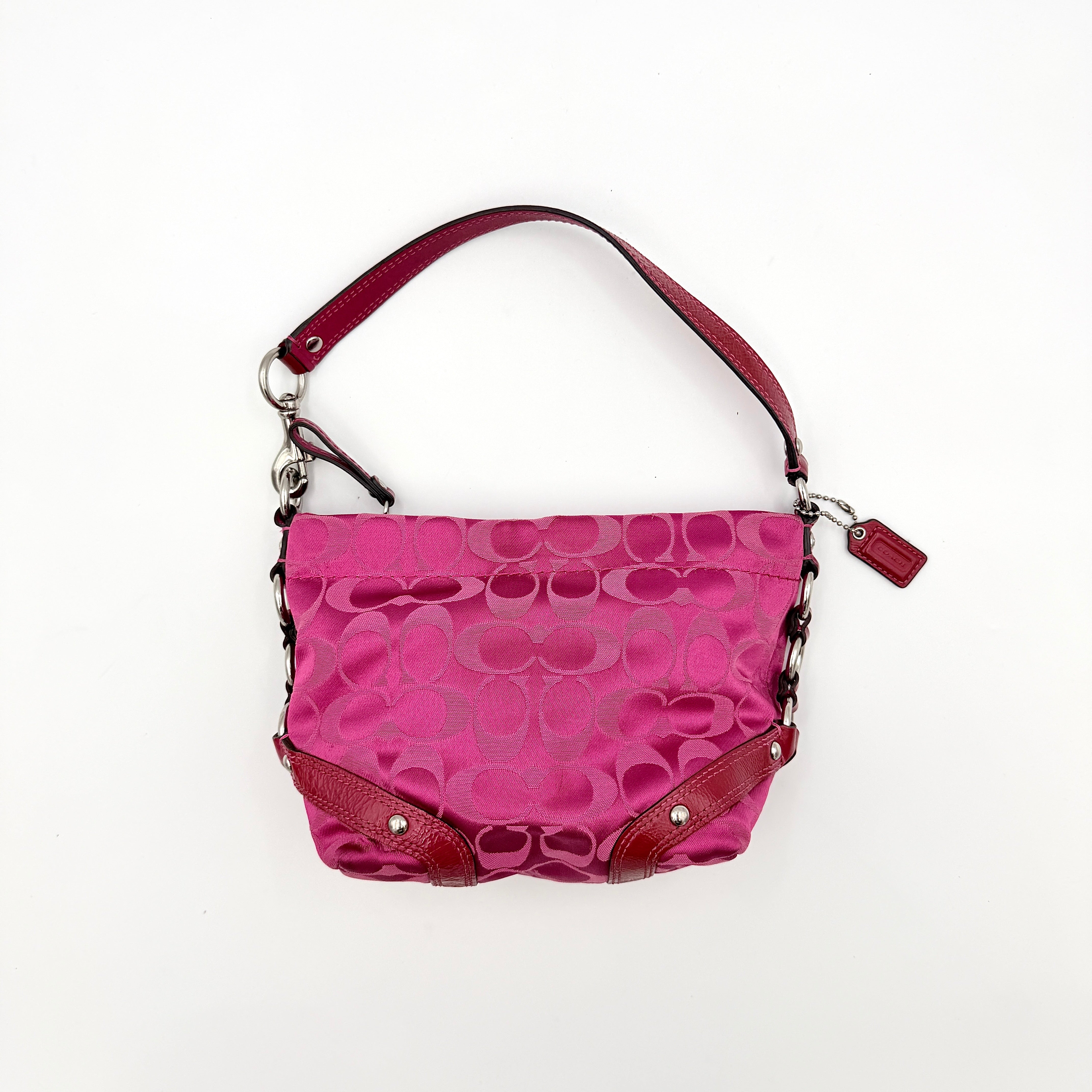 Coach Carly Hobo Shoulder Bag in vivid pink jacquard and leather, featuring signature chain detail and silver hardware.