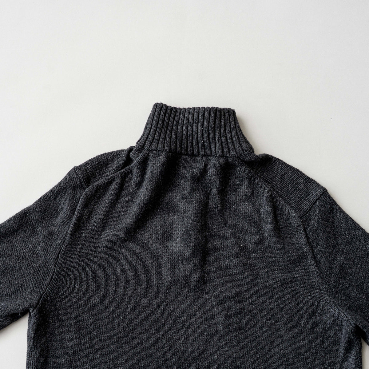 Dark grey Polo Ralph Lauren quarter zip mockneck pullover sweater with ribbed collar and green pony logo.