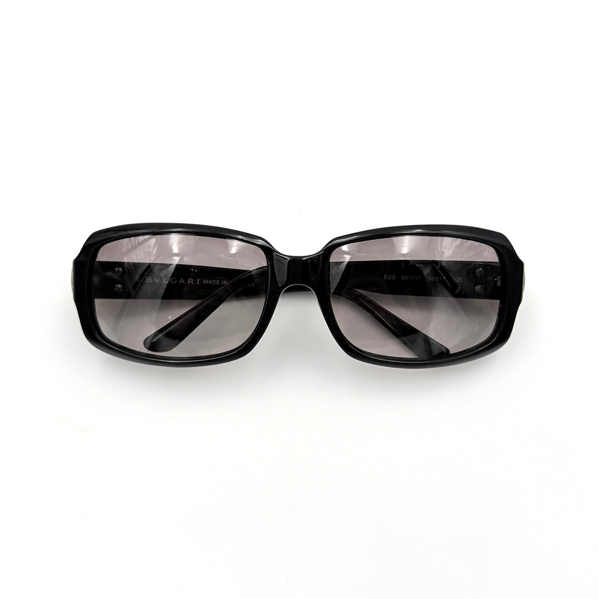 Bvlgari 829 501/11 black sunglasses with silver and gold temple hardware, displayed with case and cleaning cloth.