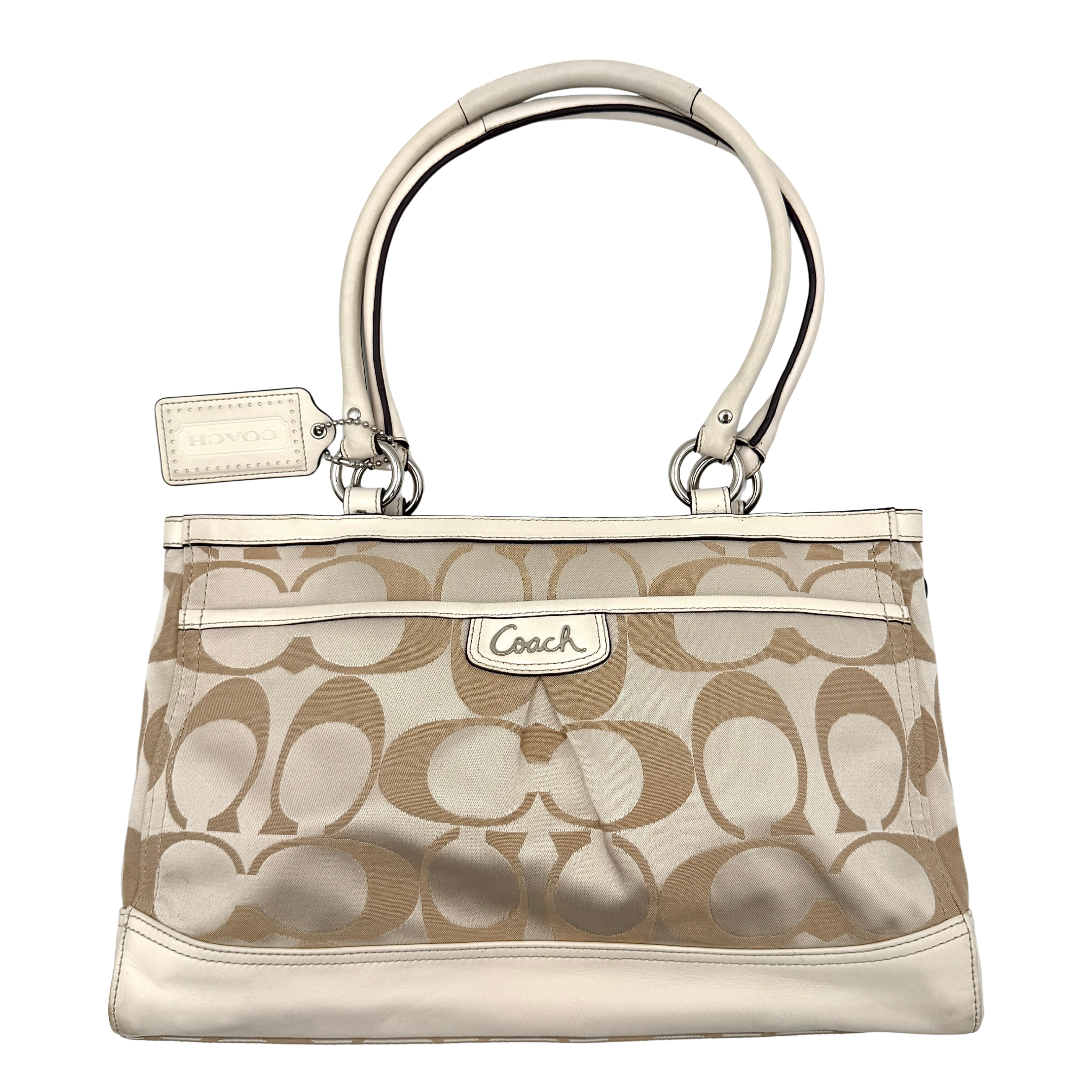 Coach Signature Carryall Shoulder Bag in beige jacquard canvas with cream leather trim and silver hardware displayed against a white background.