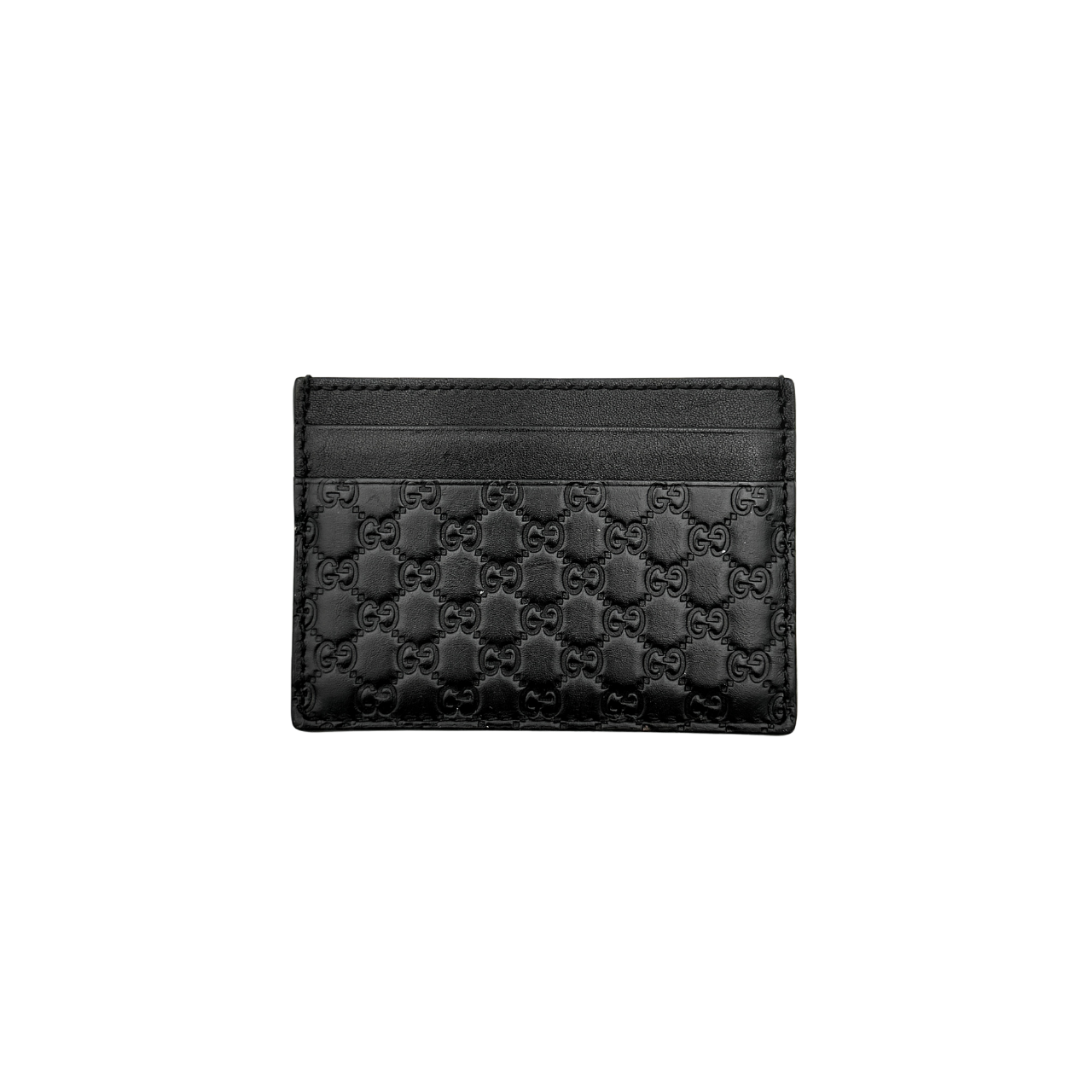 Gucci GG Microguccissima card holder in black leather with embossed micro GG motif, compact silhouette and refined finish.
