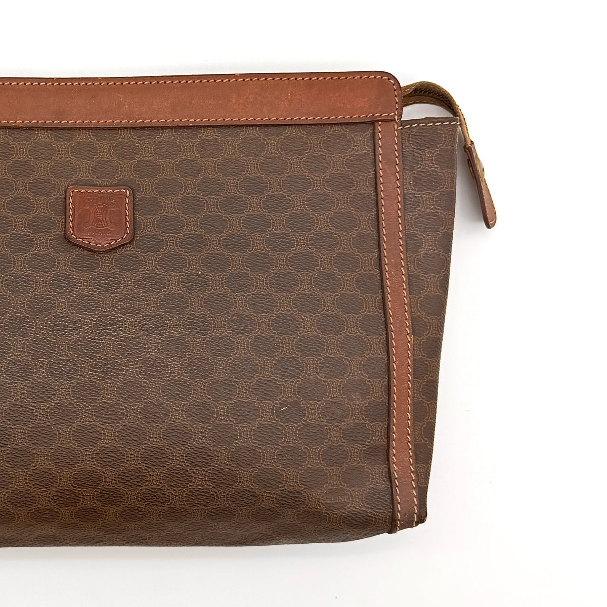 Celine Triomphe Macadam Clutch Bag in brown coated canvas with leather trim, photographed on a white background.