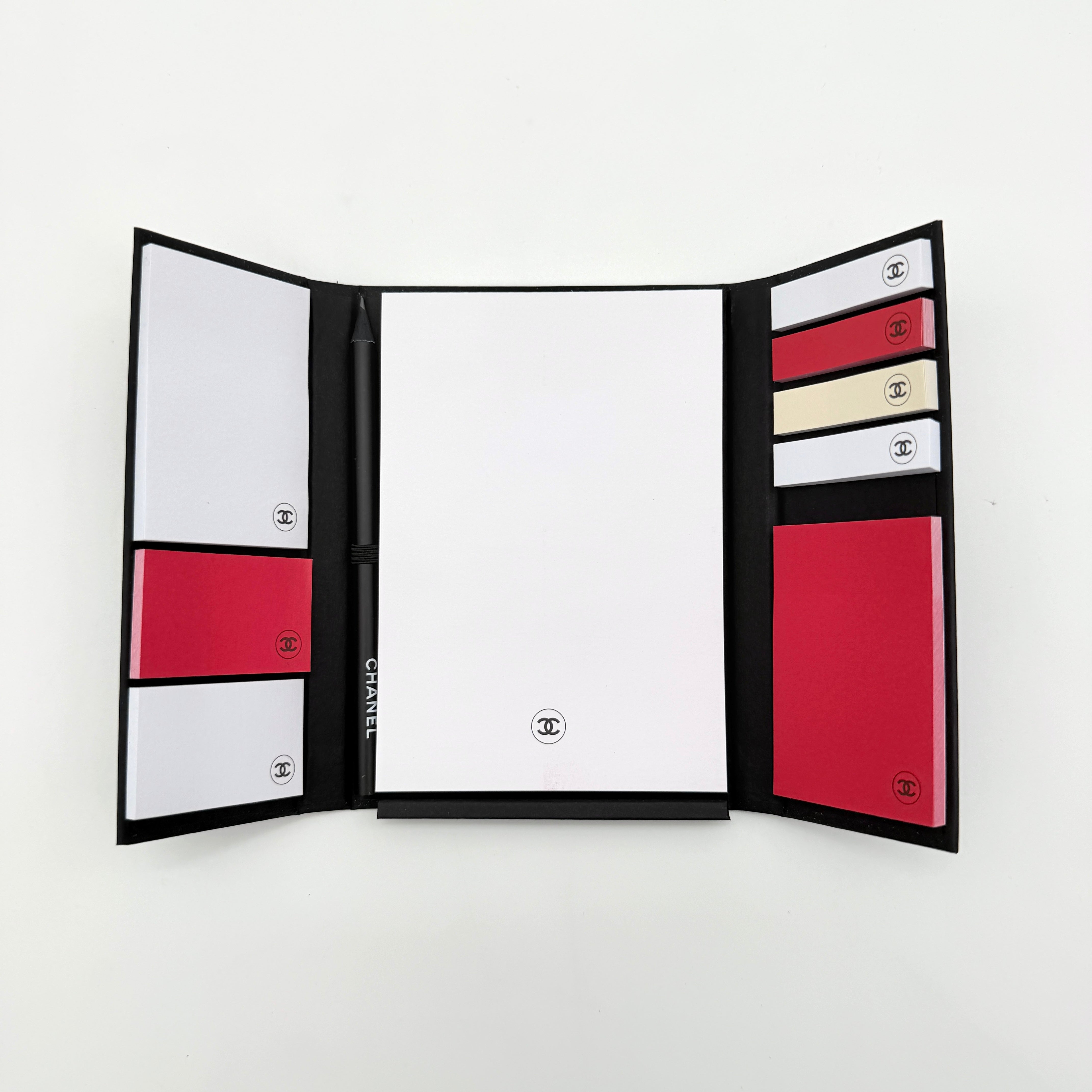 Chanel La Collection Novelty Book Stationary Set with black folder and branded box displayed on a white background