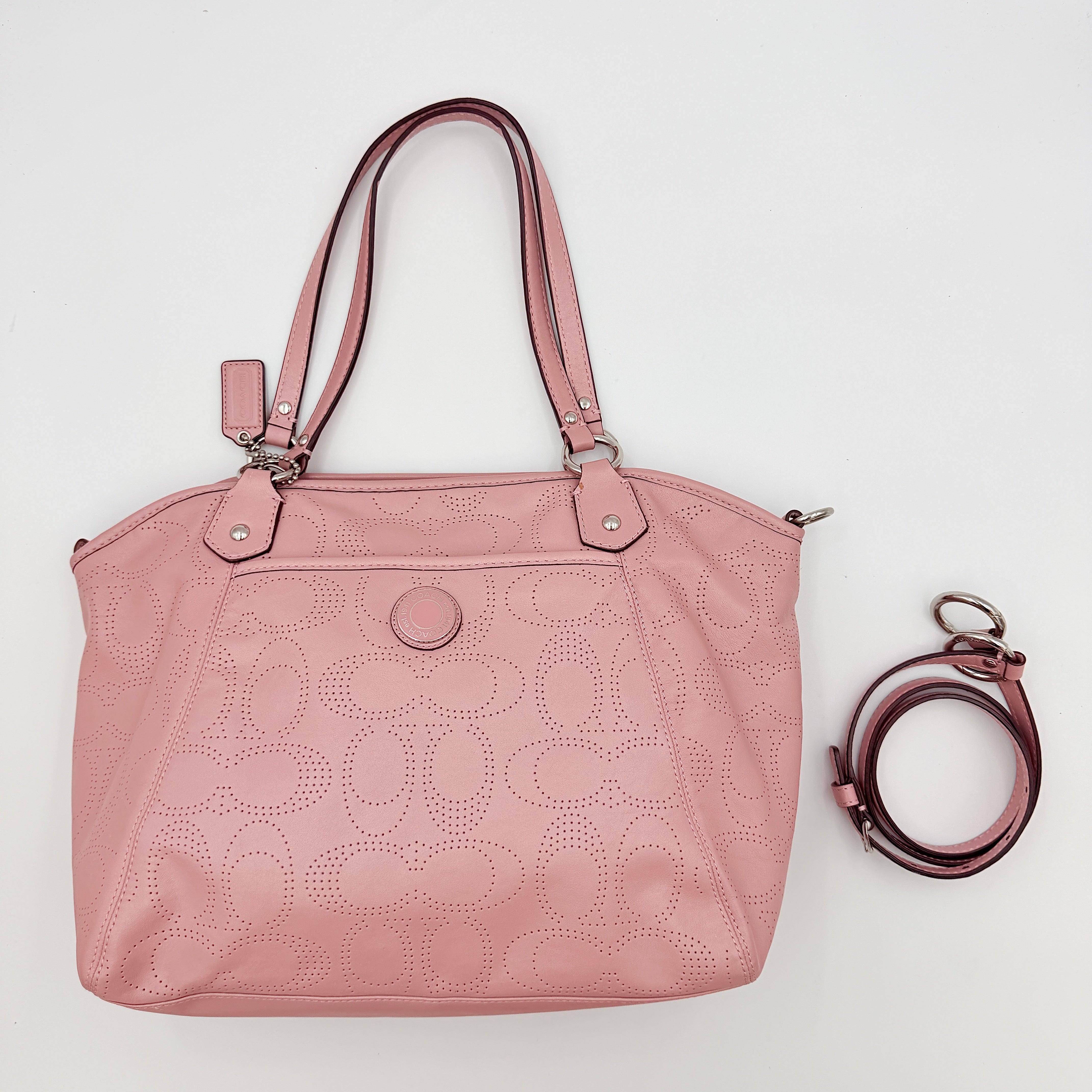 Coach 2Way Perforated Shoulder Bag in soft pink leather with silver hardware and detachable strap, displayed on a white background.