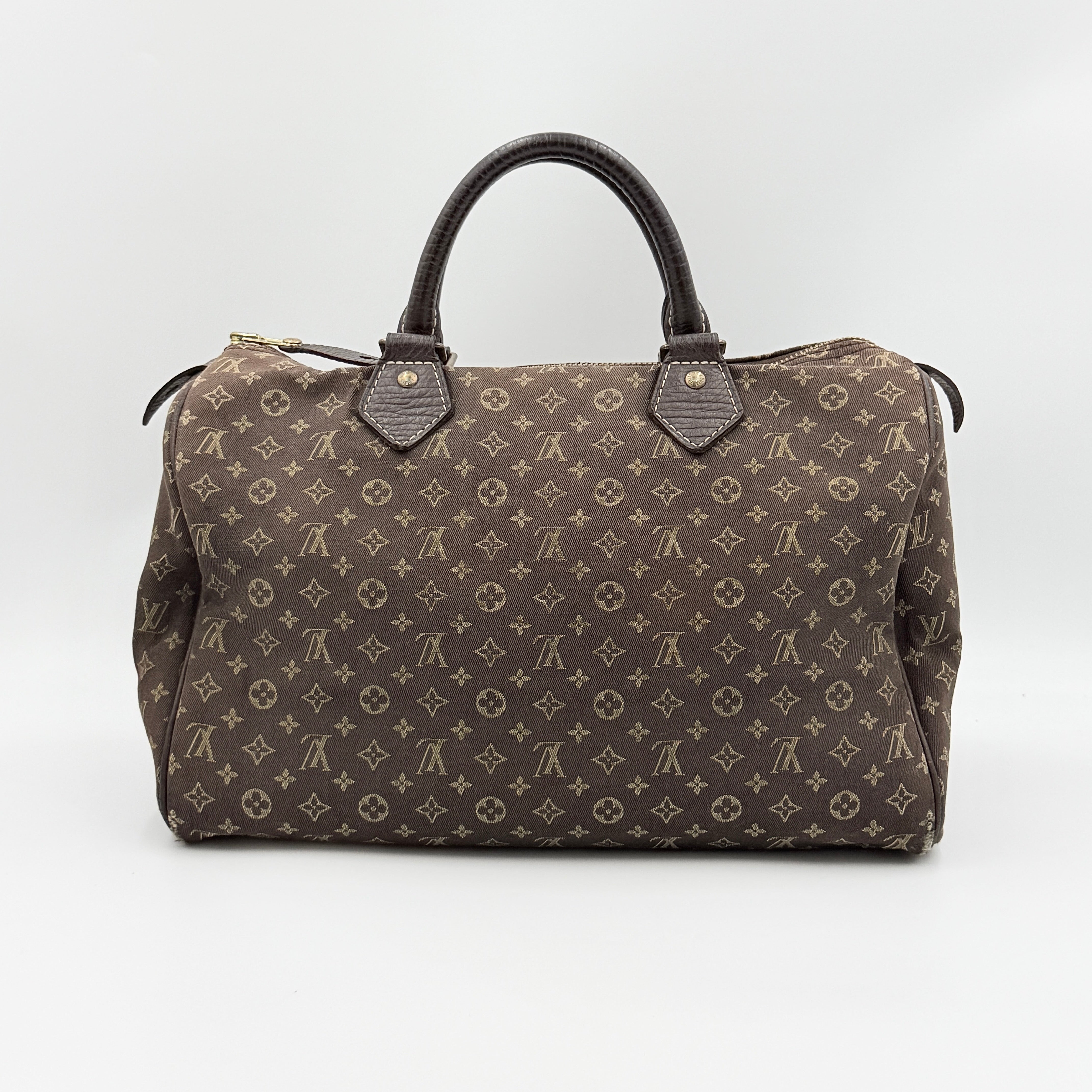 Louis Vuitton Monogram Mini Lin Speedy 30 in brown textile with top handles and monogram motif, shown against a white background.