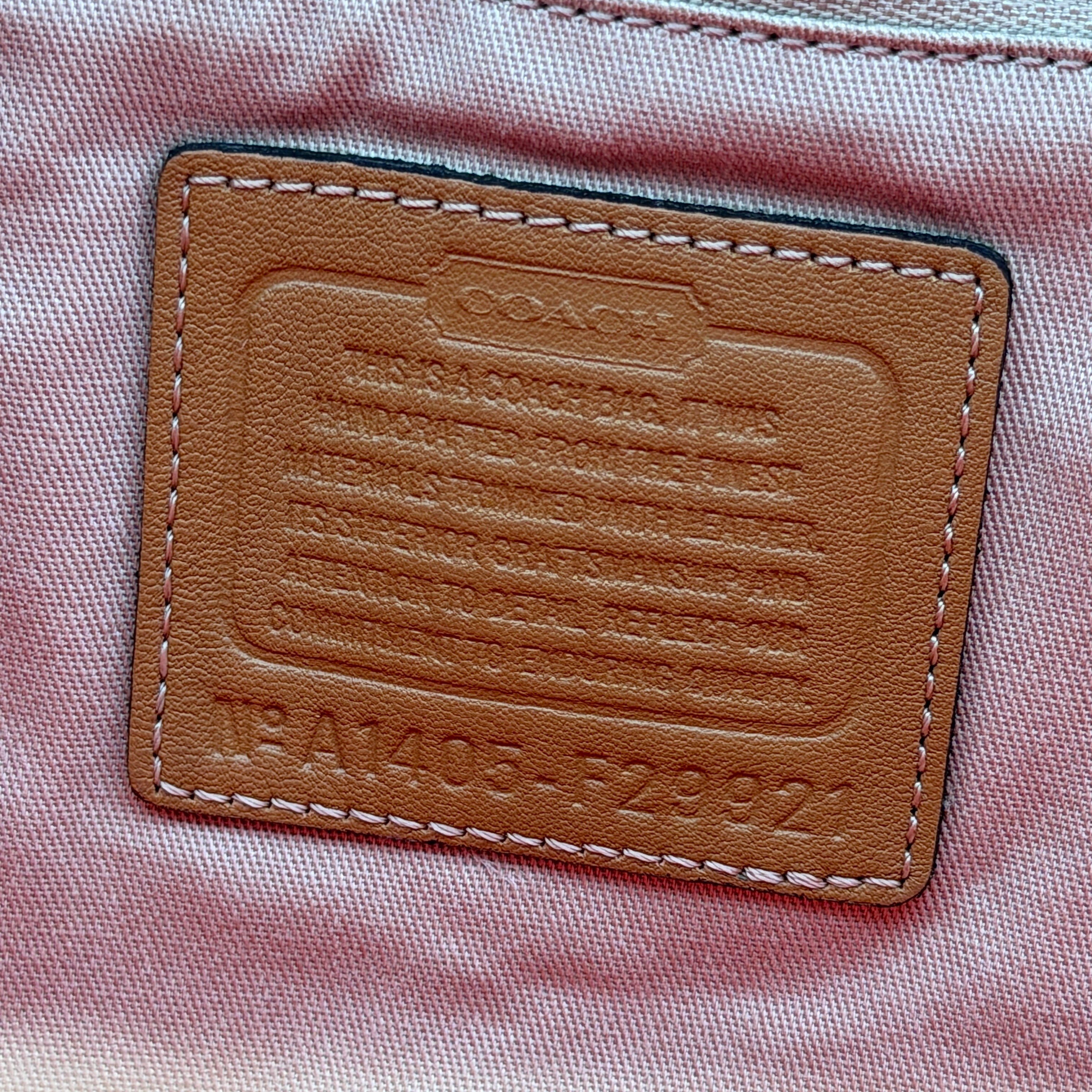 Coach Hadley Variegated Stripe Handbag in beige and tan canvas with leather trim, shown with top handles and detachable strap.