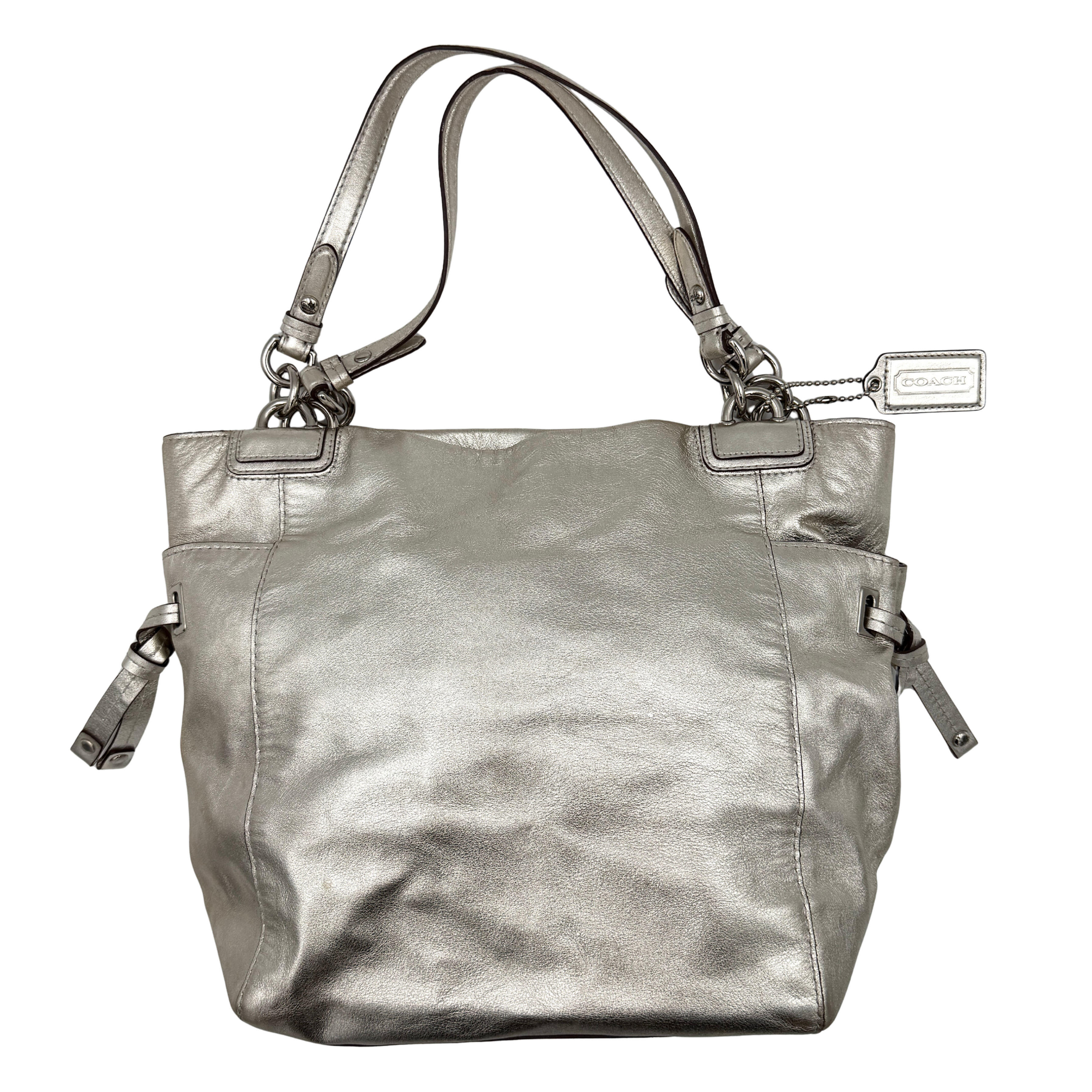 Coach Peyton Metallic Shoulder Bag in shimmering silver leather with dual top handles and polished hardware.