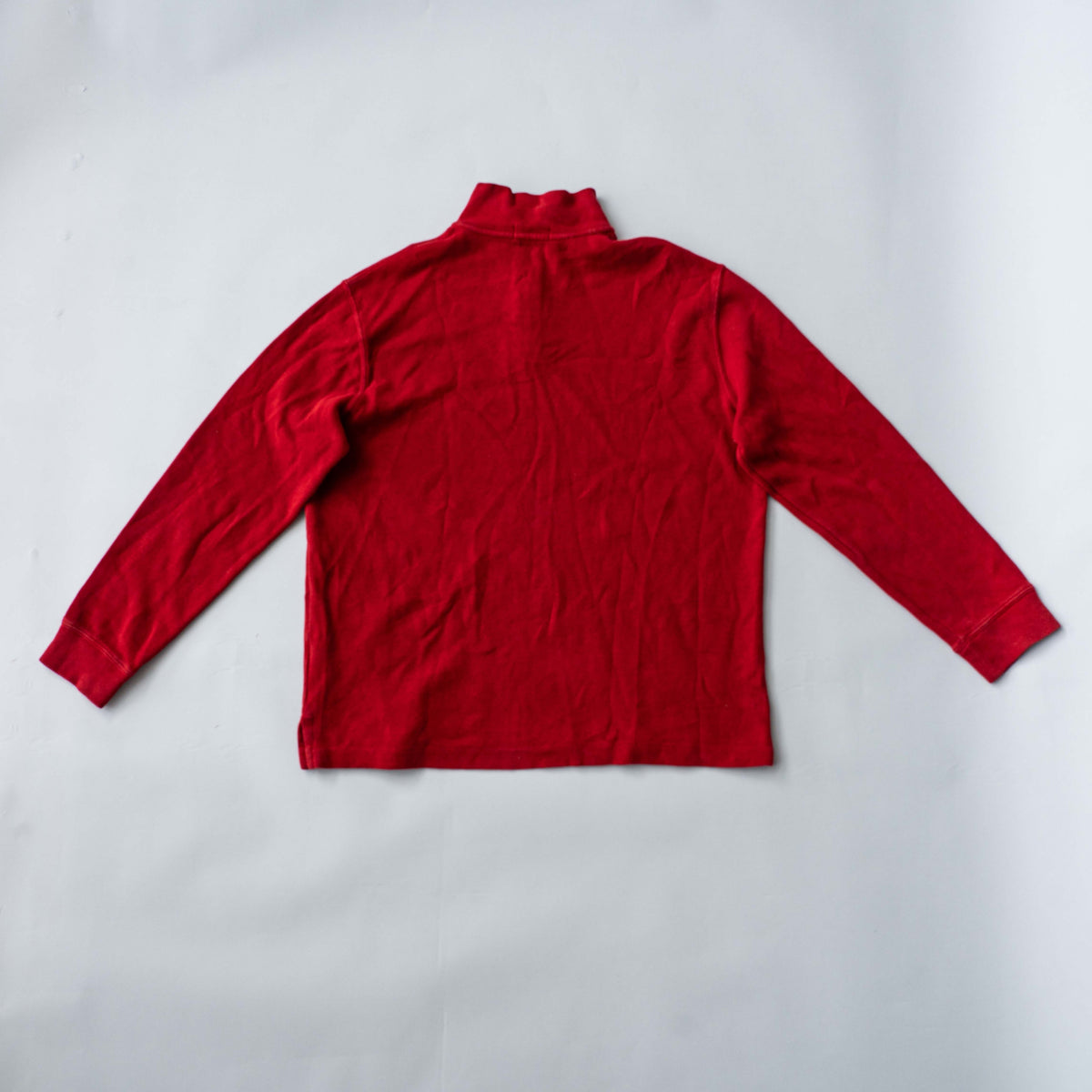 Polo Ralph Lauren red quarter zip mockneck pullover sweater with navy pony embroidery, laid flat on a white background.