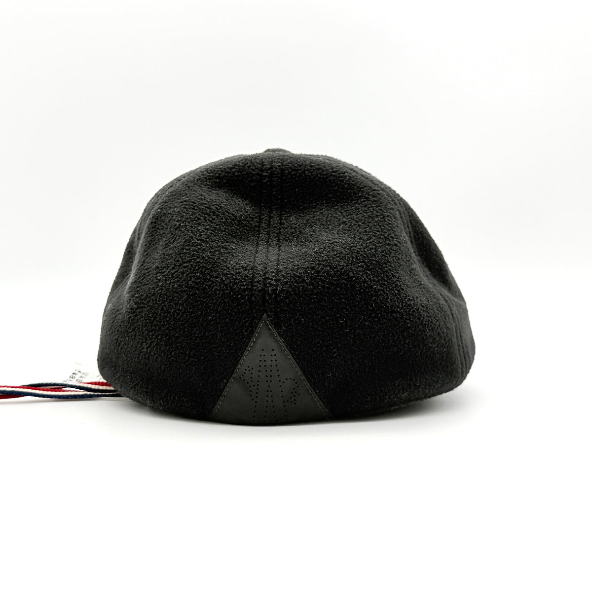Moncler Grenoble black fleece baseball cap with tri-colour logo patch on the front and tonal embroidery details.