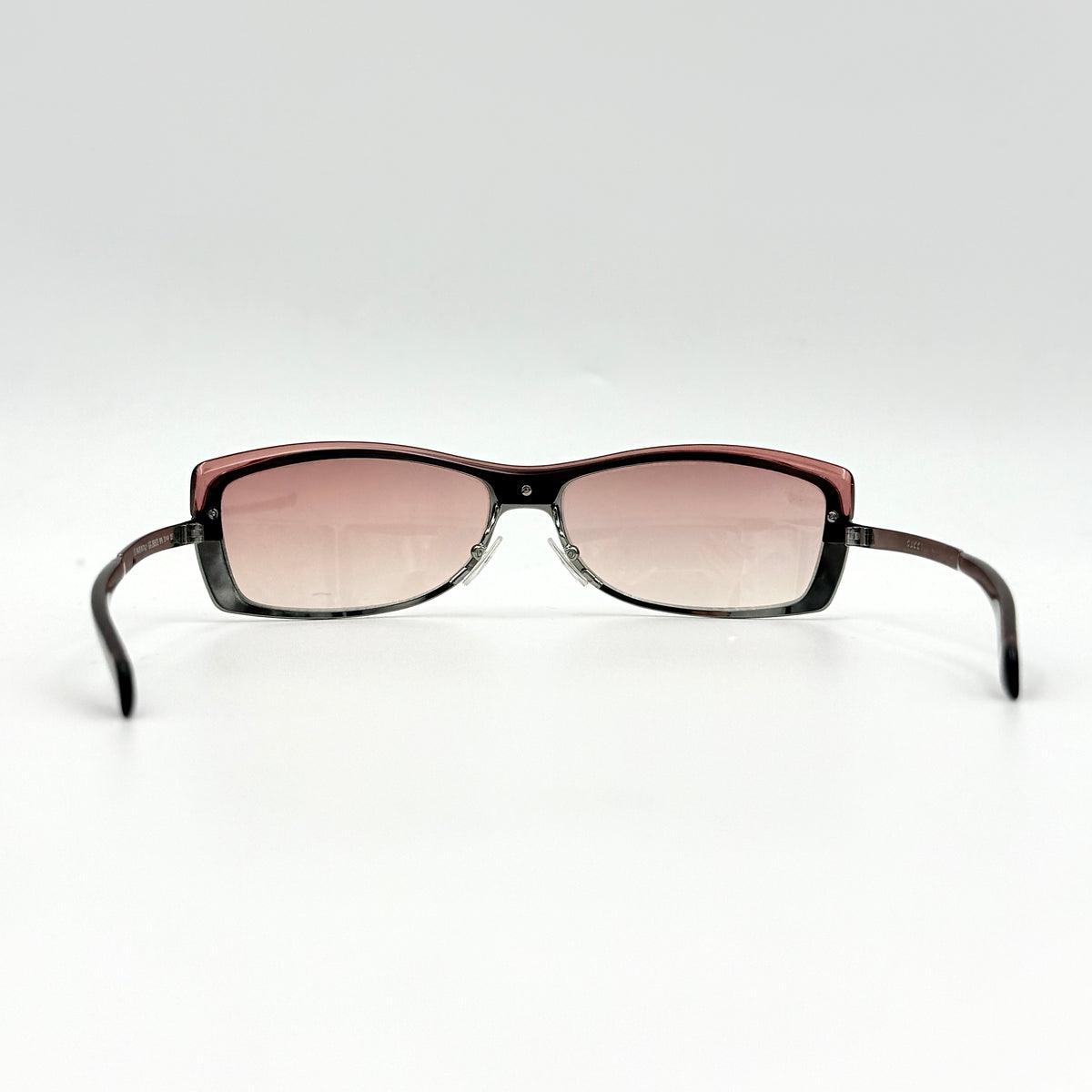 Gucci GG2689/S rectangle sunglasses in silver with pink gradient lenses, shown with case and cloth.