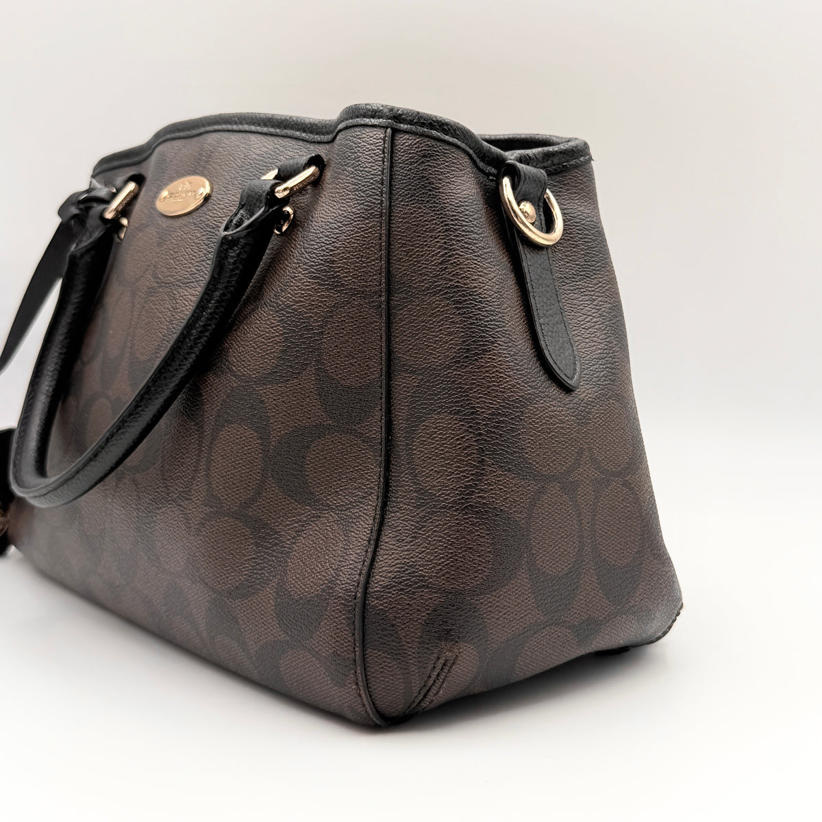 Coach 2Way Signature Margot Carryall Satchel in brown with black leather handles and gold hardware, shown with detachable strap.