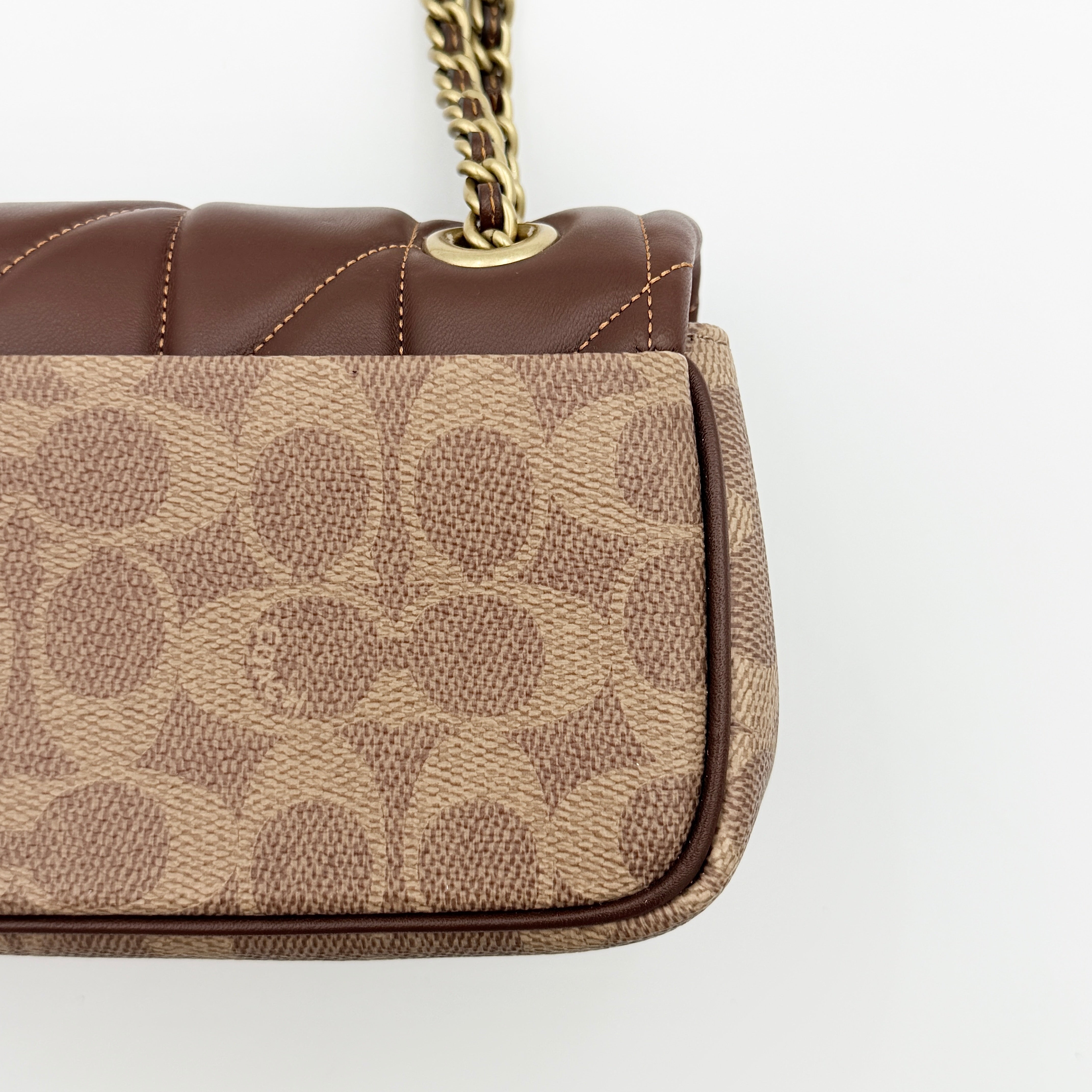 Coach Signature Quilted Tabby Shoulder Bag in brown monogram canvas with gold chain strap and oversized C clasp.