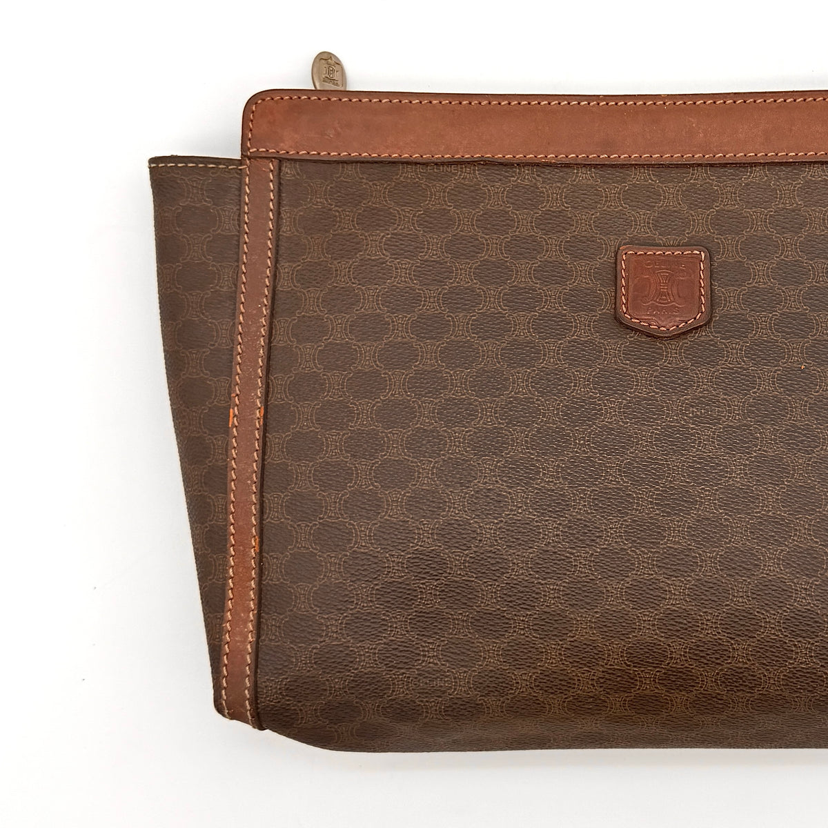 Celine Triomphe Macadam Clutch Bag in brown coated canvas with leather trim, photographed on a white background.