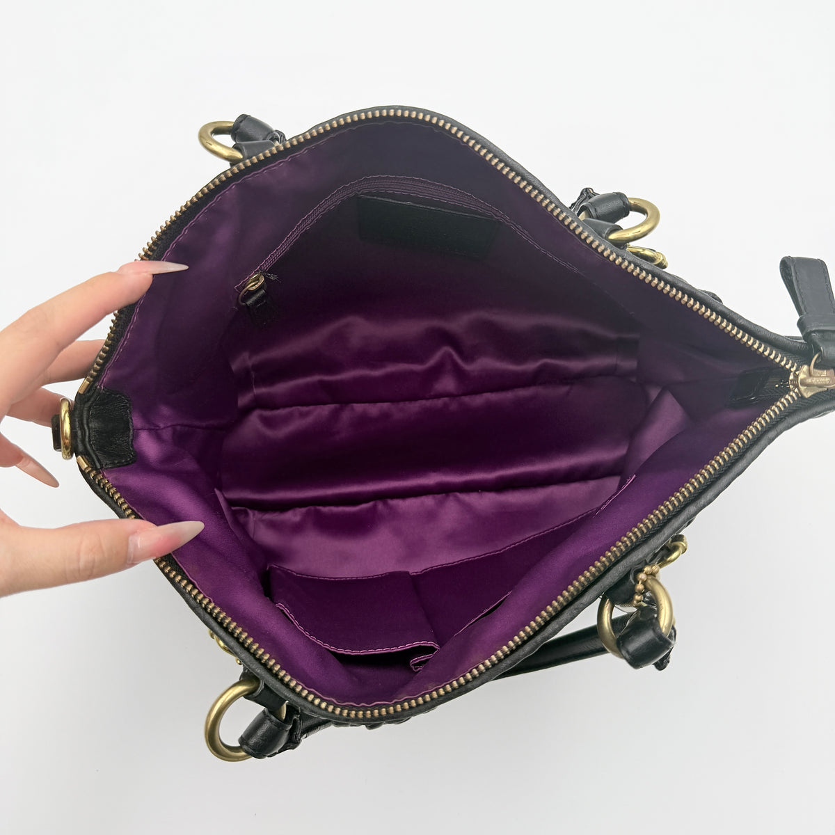 Coach Sophia Madison Pleated Shoulder Bag in black leather with gold hardware, displayed with detachable strap and dust bag.