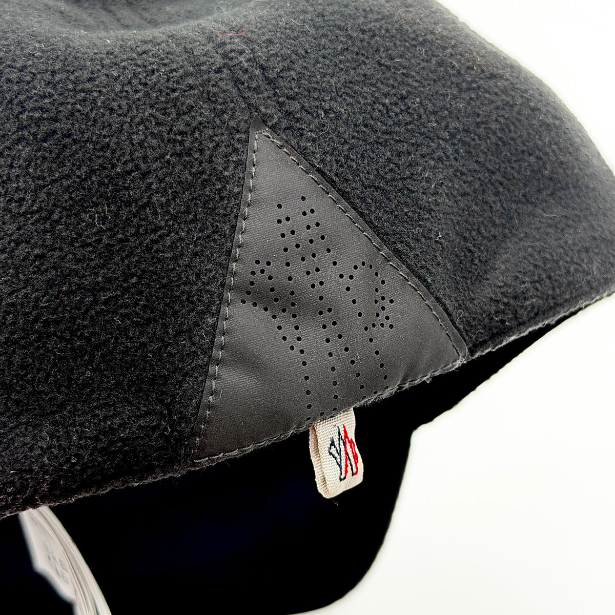 Moncler Grenoble black fleece baseball cap with tri-colour logo patch on the front and tonal embroidery details.