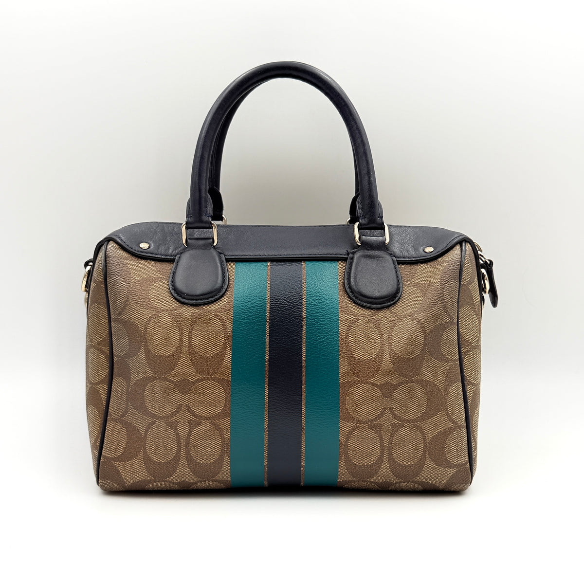Coach Signature Mini Bennett Boston Bag in monogram canvas with navy and teal varsity stripes and dark navy leather trim.