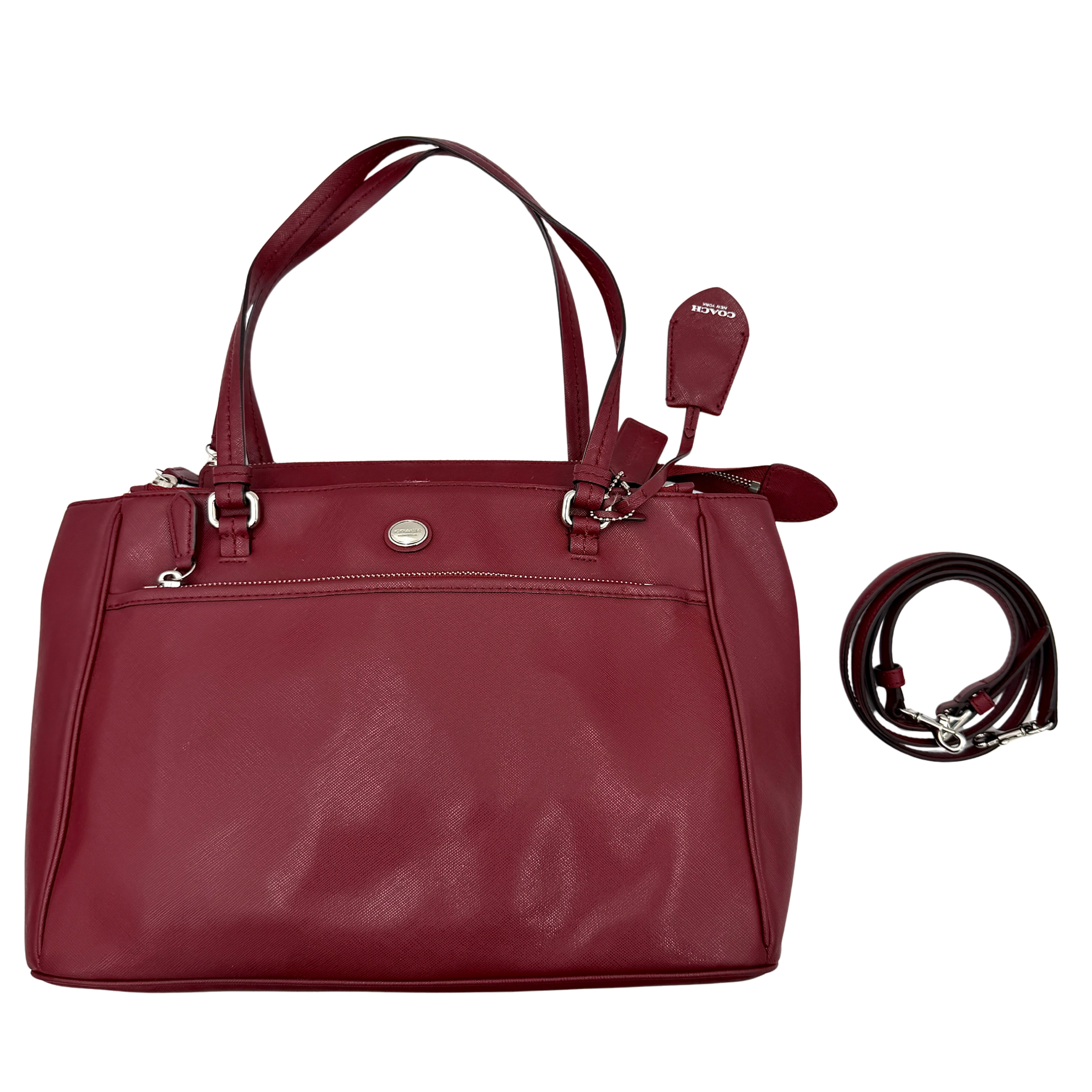 Coach 2Way Peyton Carryall Shoulder Bag in maroon leather with silver hardware, top handles, and detachable strap styled beside the bag.