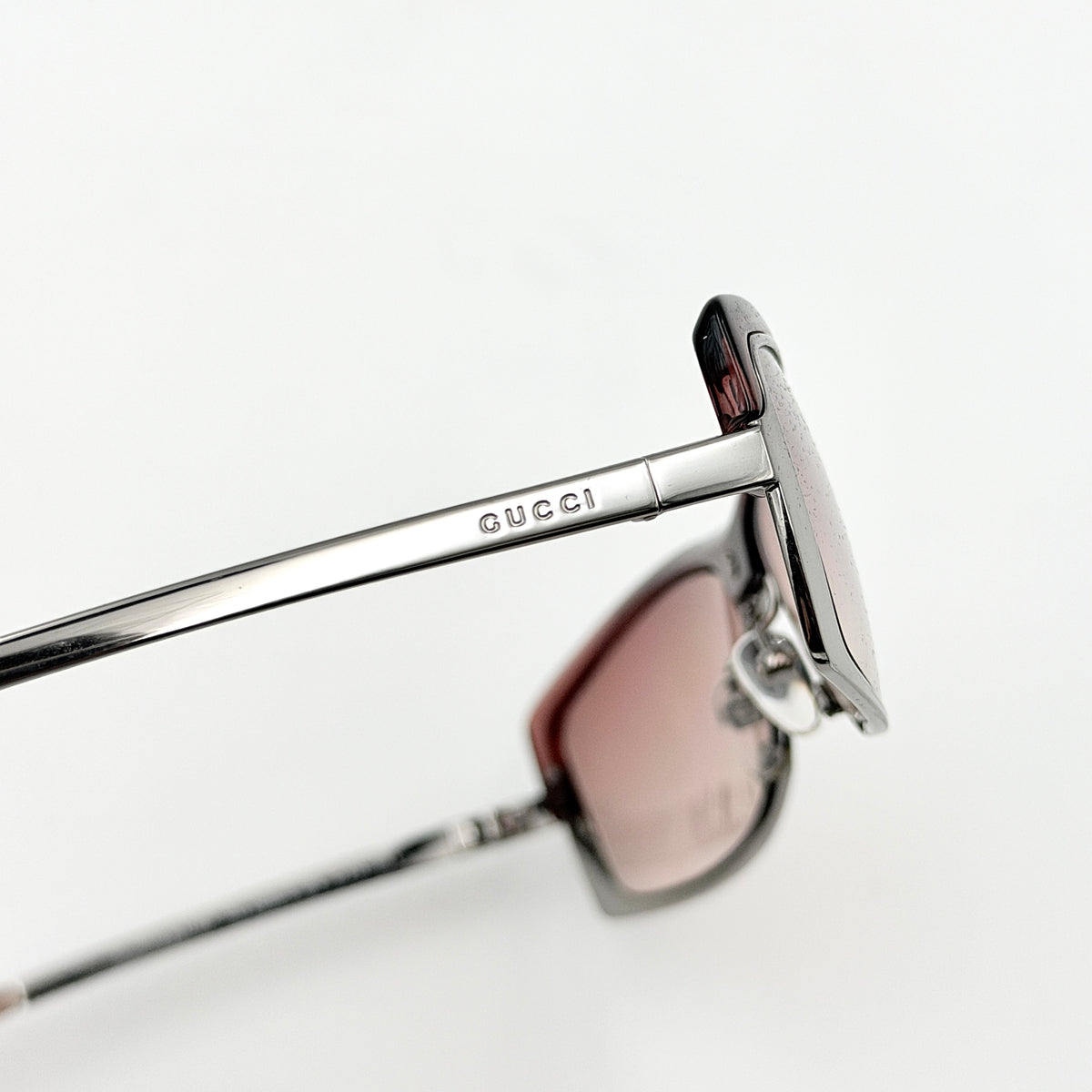 Gucci GG2689/S rectangle sunglasses in silver with pink gradient lenses, shown with case and cloth.