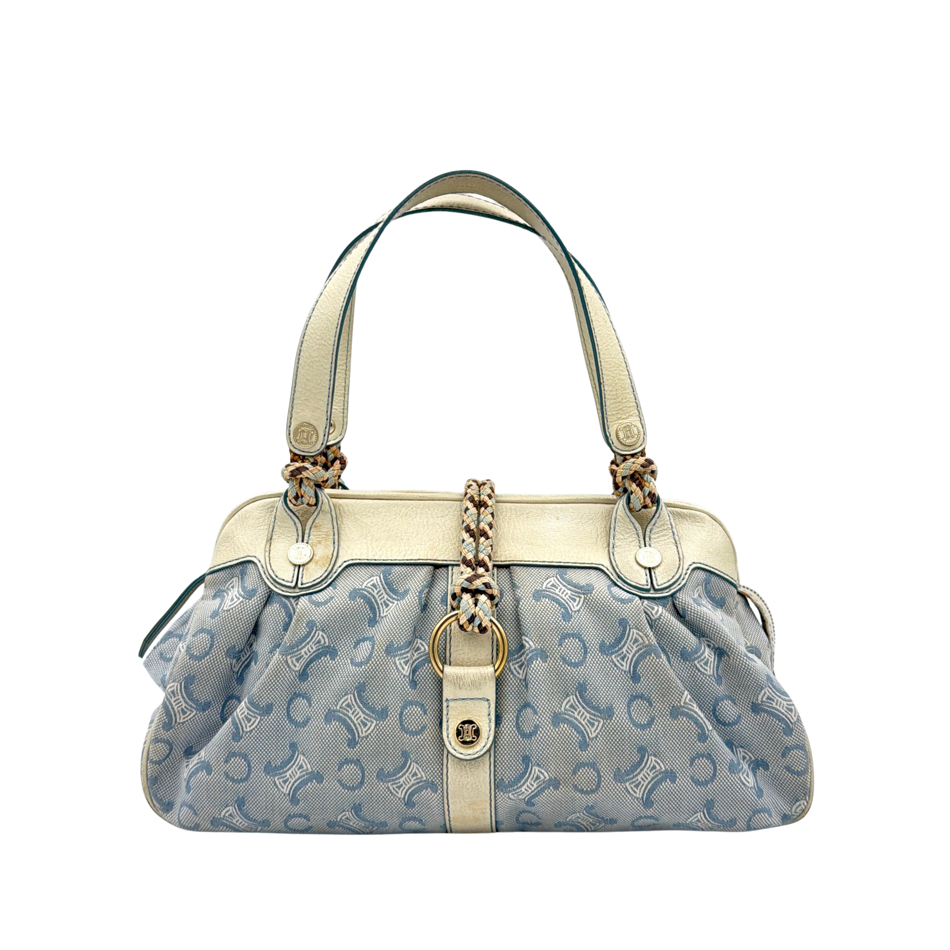 Front view of the Celine Macadam Canvas Shoulder Bag in blue canvas and cream leather with braided handles and gold hardware.