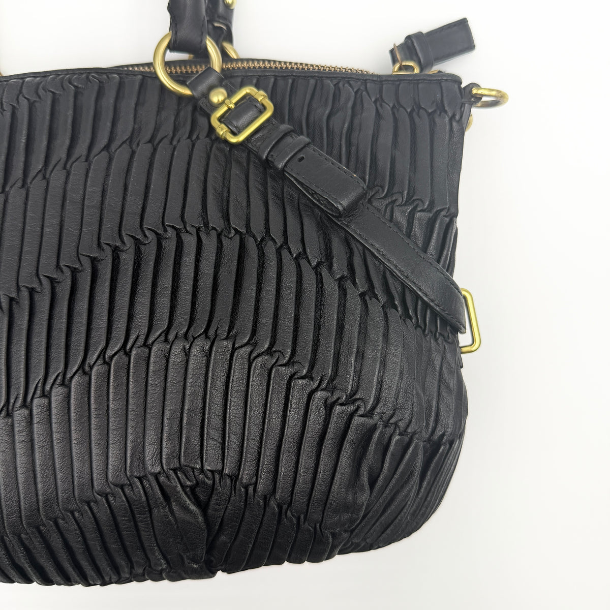 Coach Sophia Madison Pleated Shoulder Bag in black leather with gold hardware, displayed with detachable strap and dust bag.