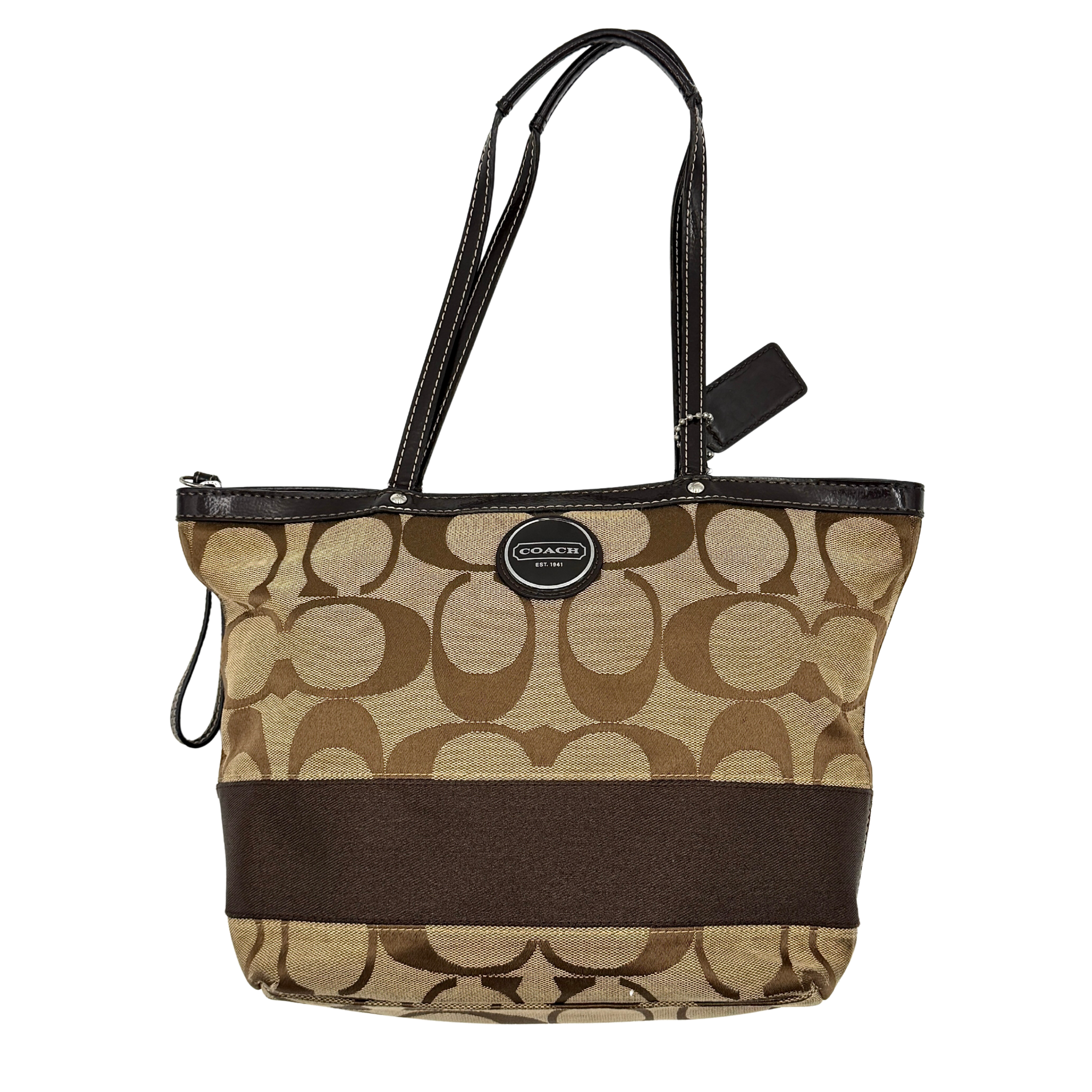 Coach Signature Stripe Tote Bag in beige and brown with bold monogram canvas, leather trim, and dual shoulder straps.