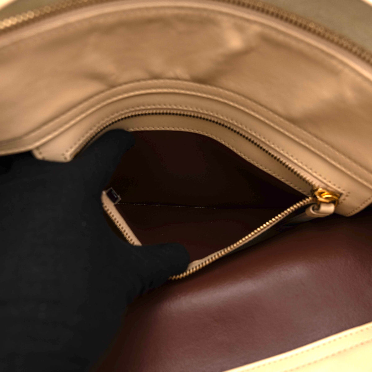 Chloé C Zipped Tote Bag in beige leather with gold hardware, shown with structured dual straps and front logo detail.