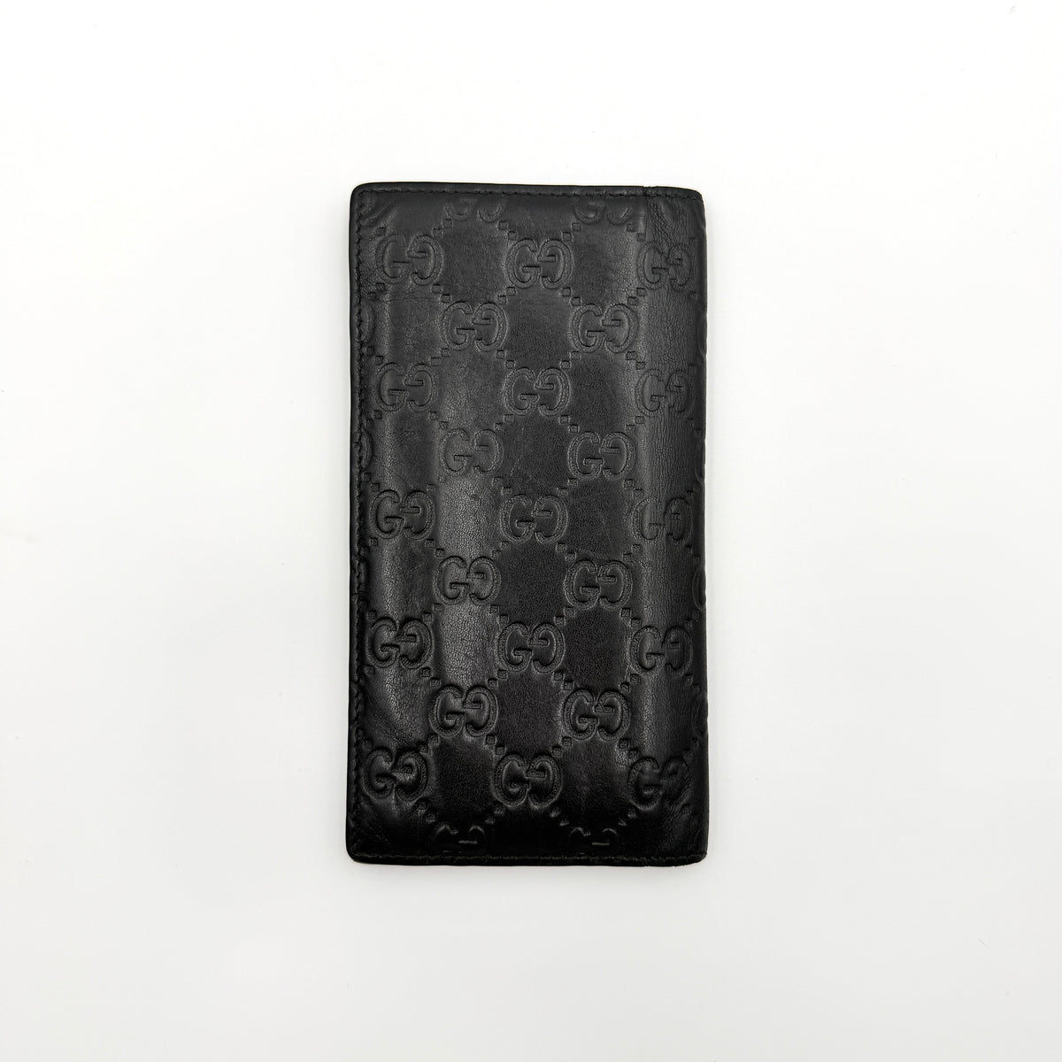 Gucci Guccissima GG embossed long wallet in black leather with box and care card.