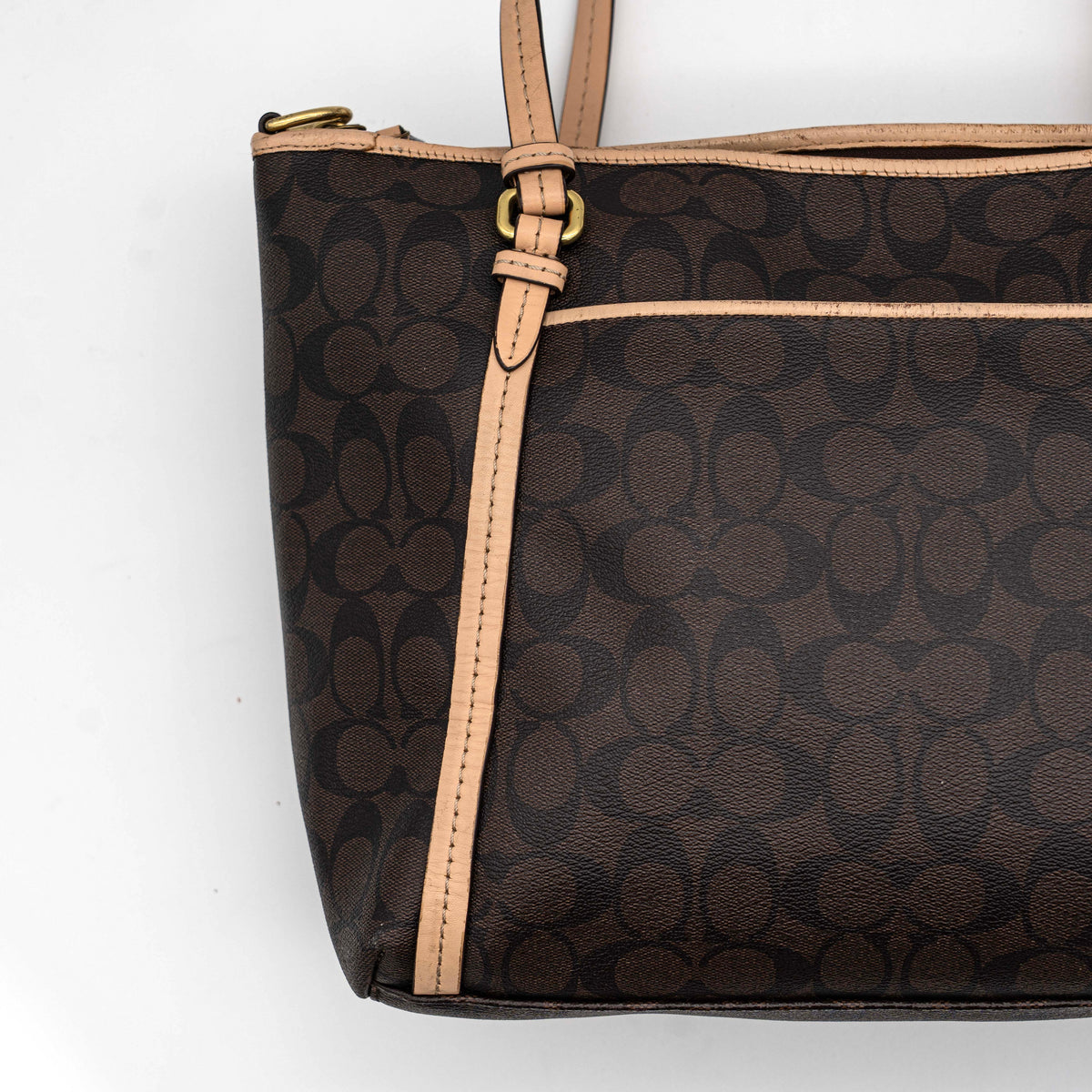 Coach Signature Peyton Pocket tote bag in brown canvas with tan leather trim, shown with both handles and detachable strap.