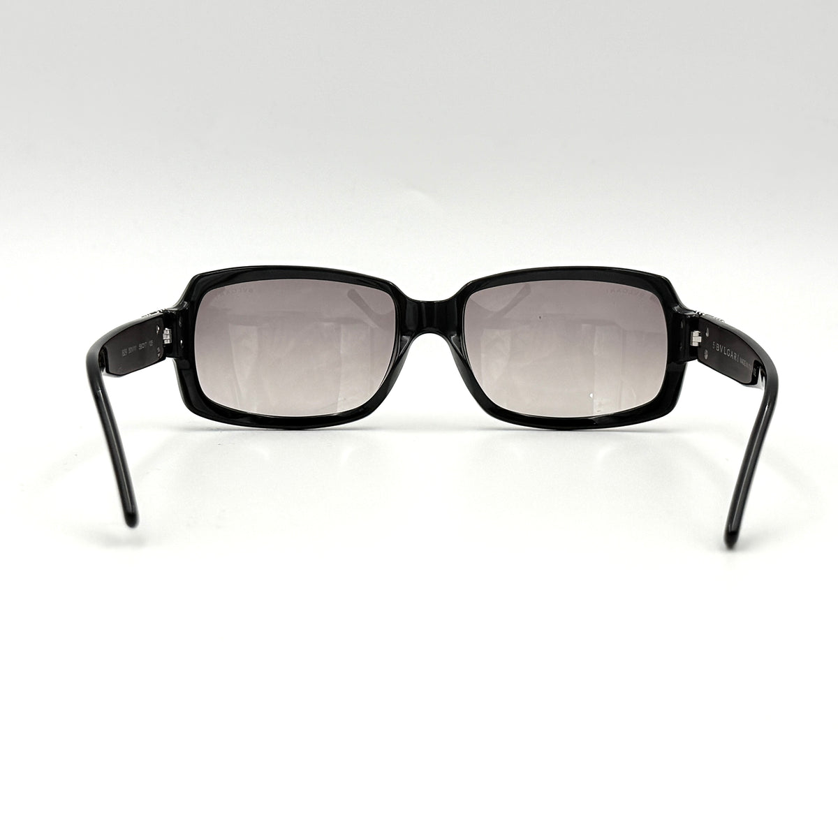 Bvlgari 829 501/11 black sunglasses with silver and gold temple hardware, displayed with case and cleaning cloth.