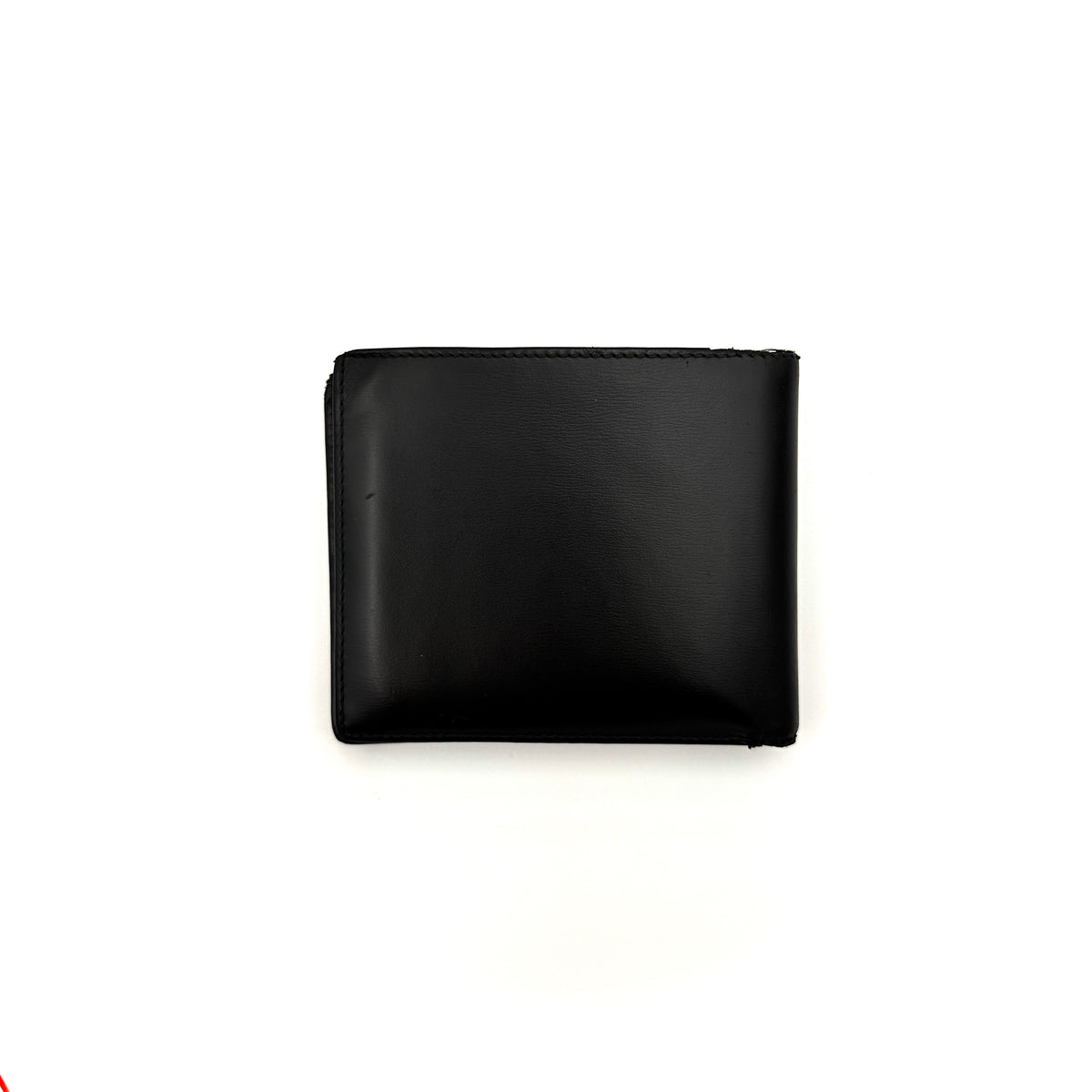 Cartier Must de Cartier black leather bifold wallet, shown with its signature red box and authentication card.