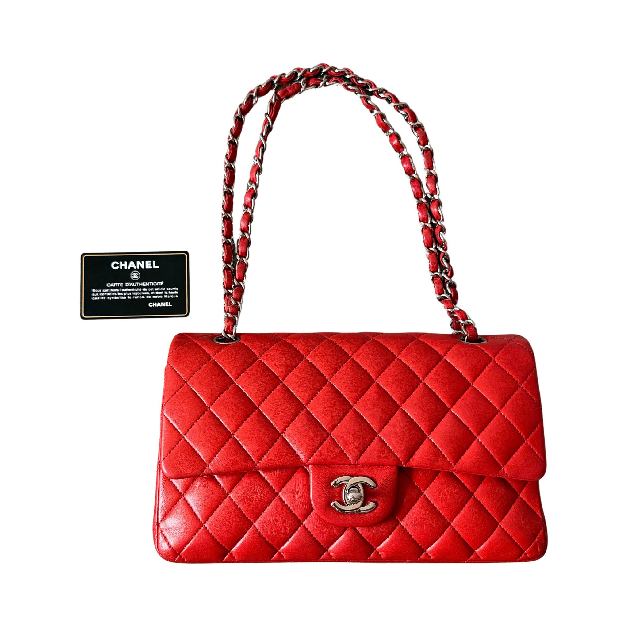 Chanel double flap shoulder bag in quilted red leather with silver-tone hardware and chain leather strap.