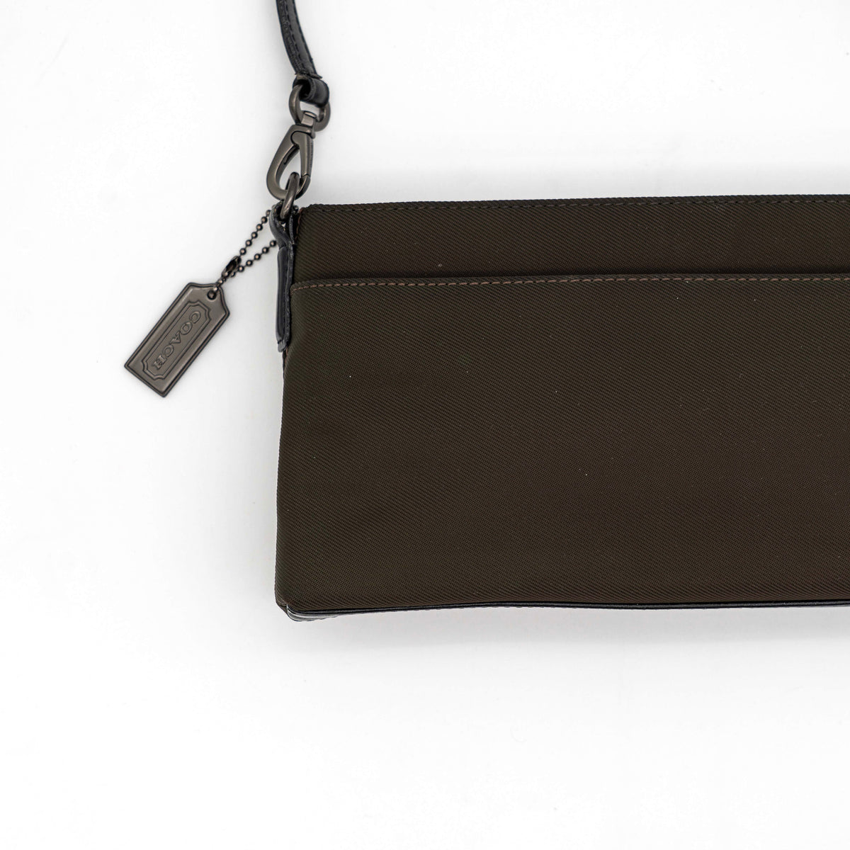Coach Mercer Demi Tote Bag in brown nylon with black leather trim and gunmetal hardware, shown with signature Coach tag.