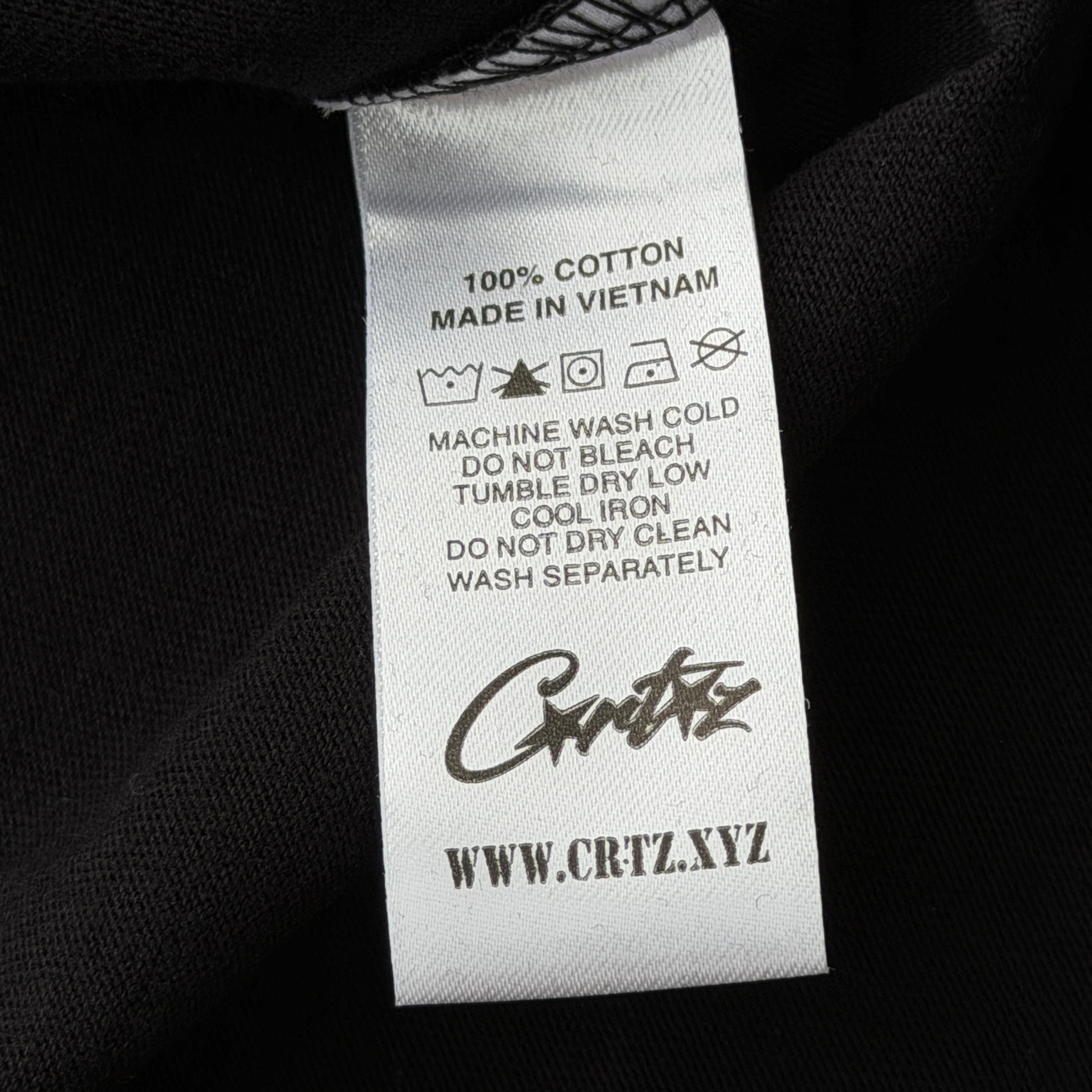 Corteiz Allstarz Tee in black with a bold yellow script logo across the chest, presented flat against a white background.