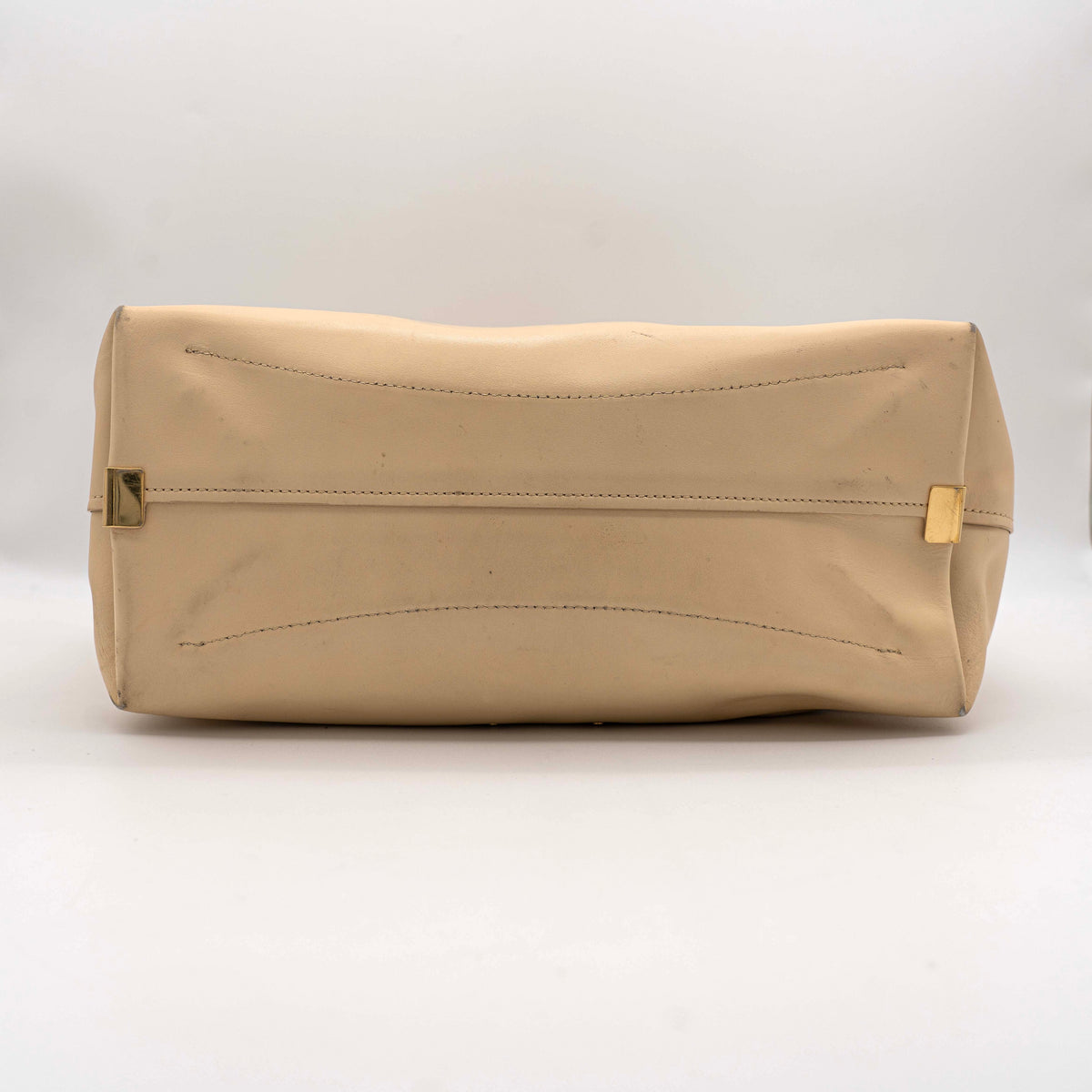 Chloé C Zipped Tote Bag in beige leather with gold hardware, shown with structured dual straps and front logo detail.