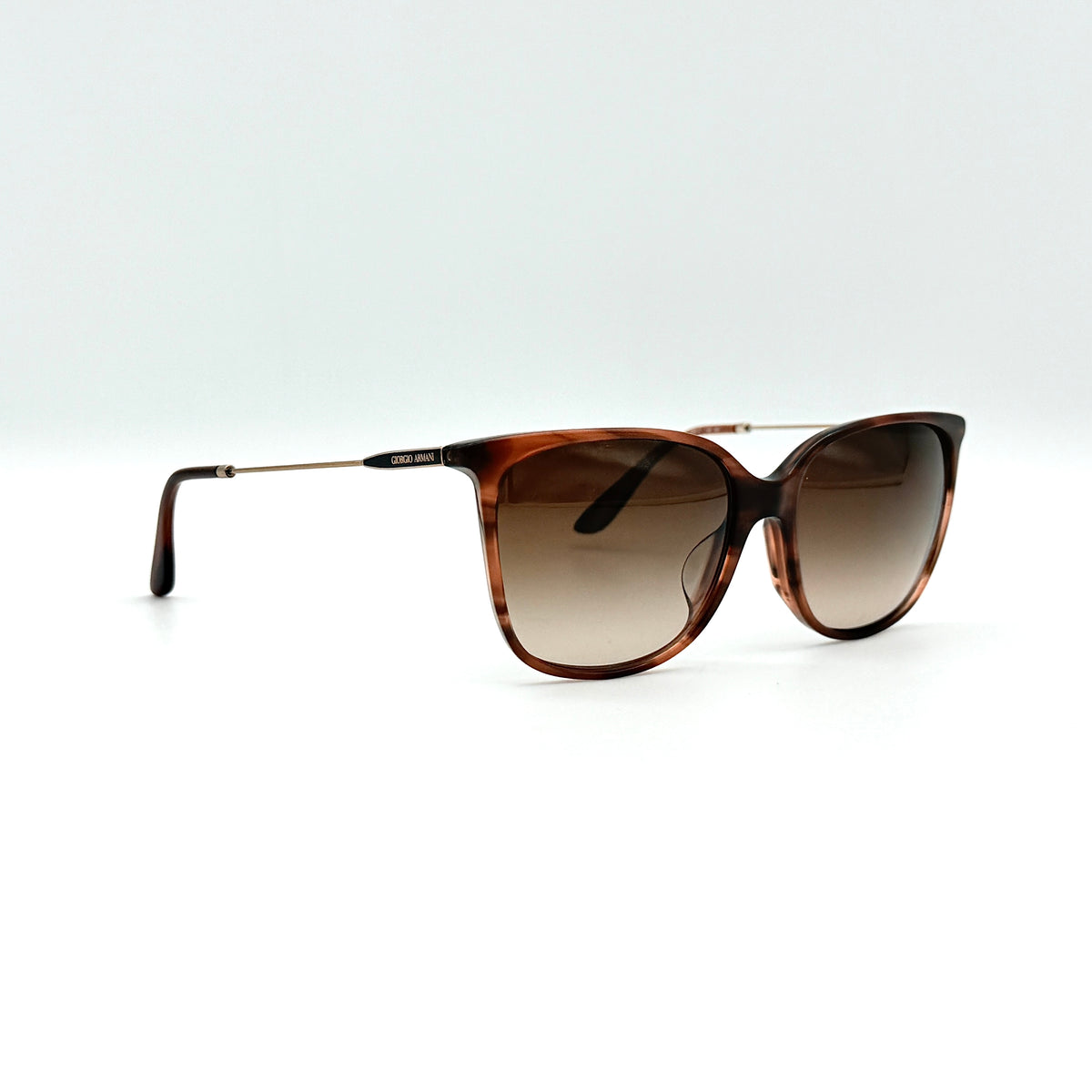 Giorgio Armani AR 8080-F sunglasses in brown tortoise with gradient brown lenses and slim gold-tone arms, displayed at an angle.