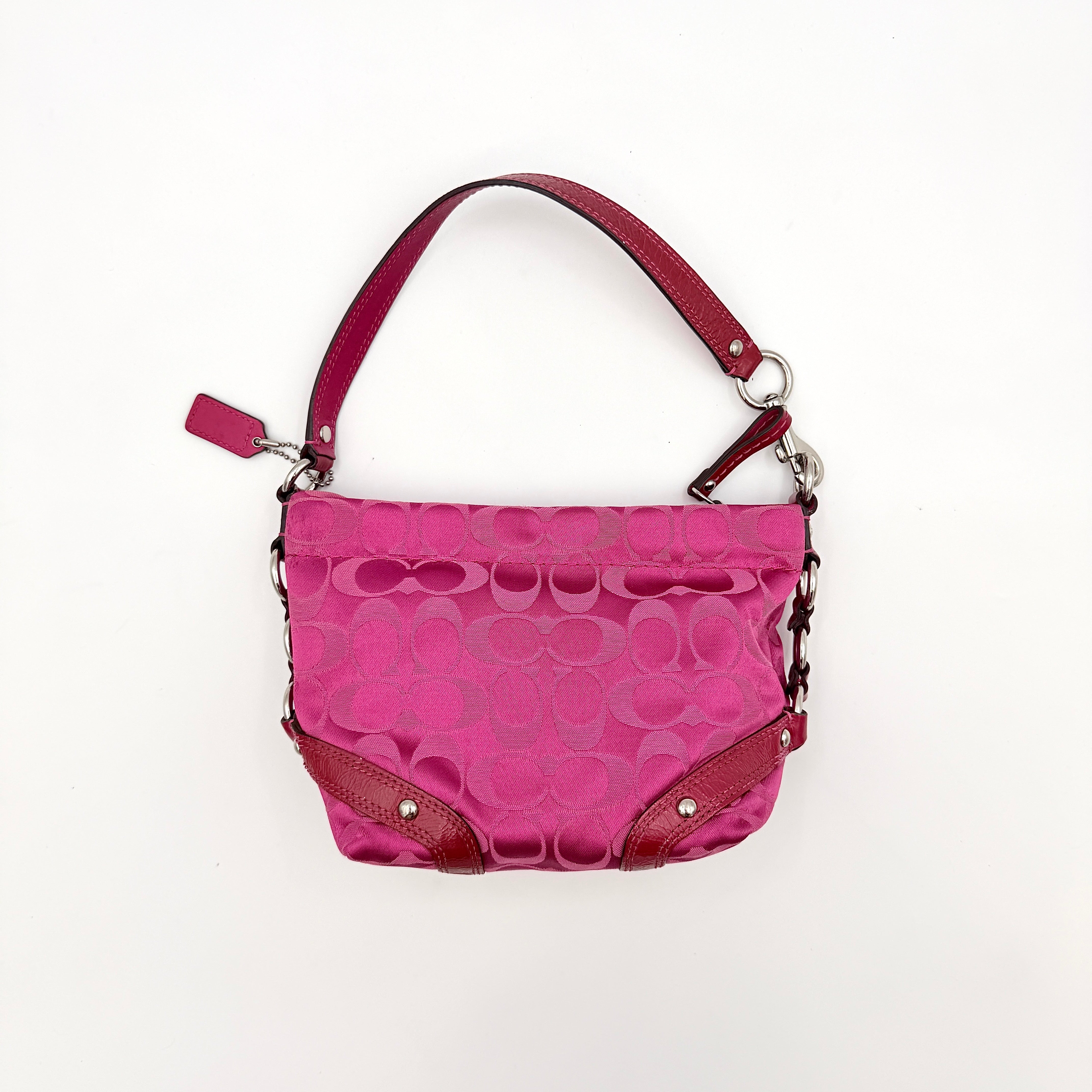 Coach Carly Hobo Shoulder Bag in vivid pink jacquard and leather, featuring signature chain detail and silver hardware.