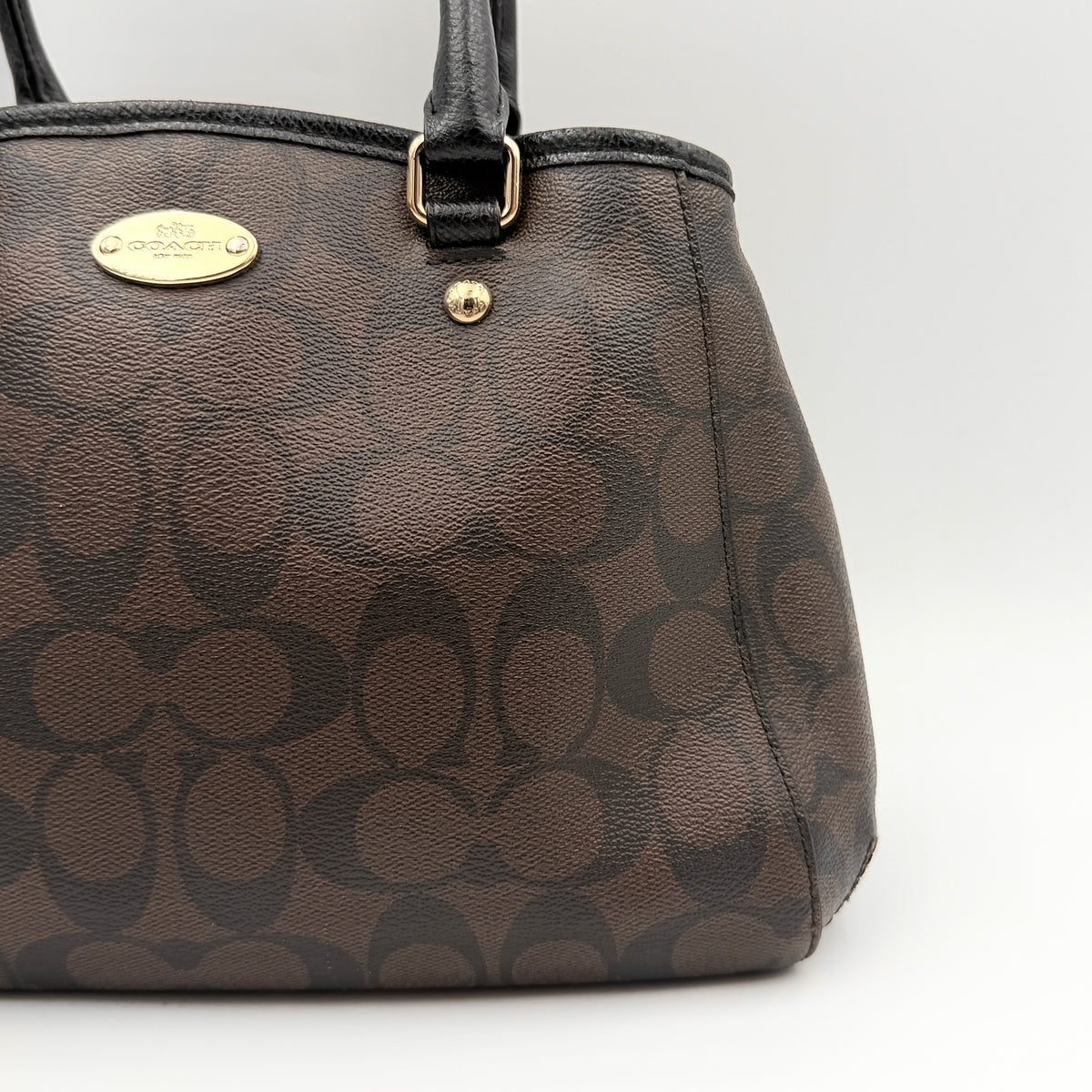 Coach 2Way Signature Margot Carryall Satchel in brown with black leather handles and gold hardware, shown with detachable strap.