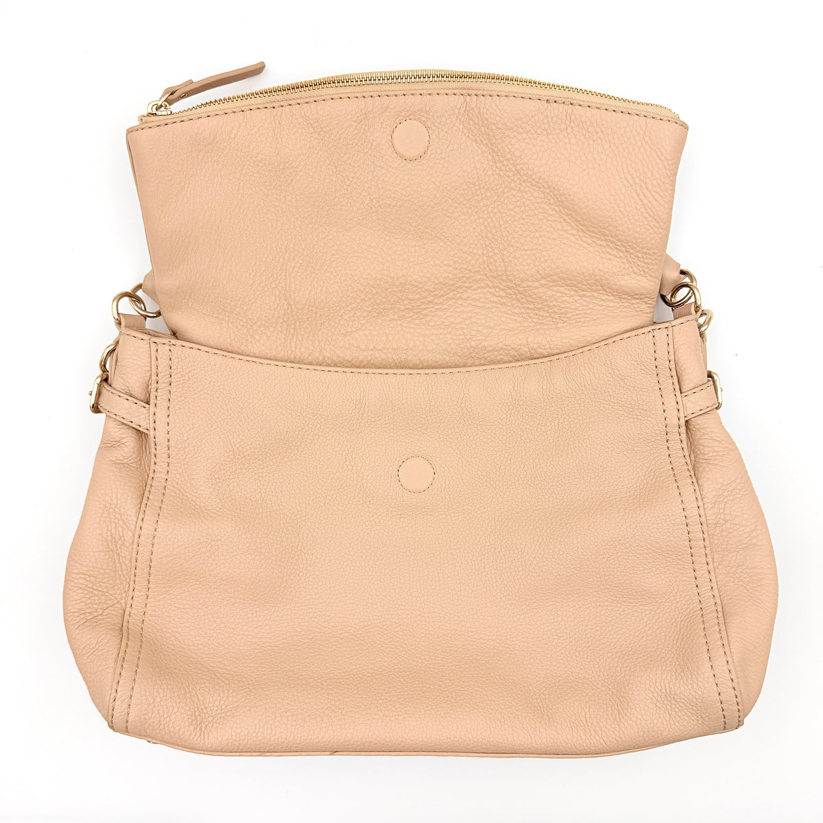 Kate Spade Cobble Hill Little Minka in beige pebbled leather with both top handle and detachable strap displayed.