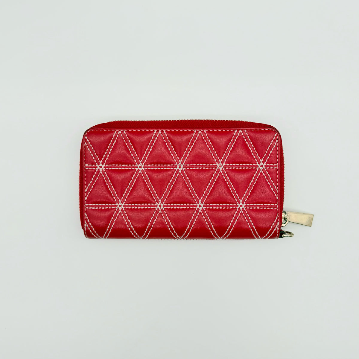 Front view of the Michael Kors red quilted large wallet with gold zip and MK monogram stitching.