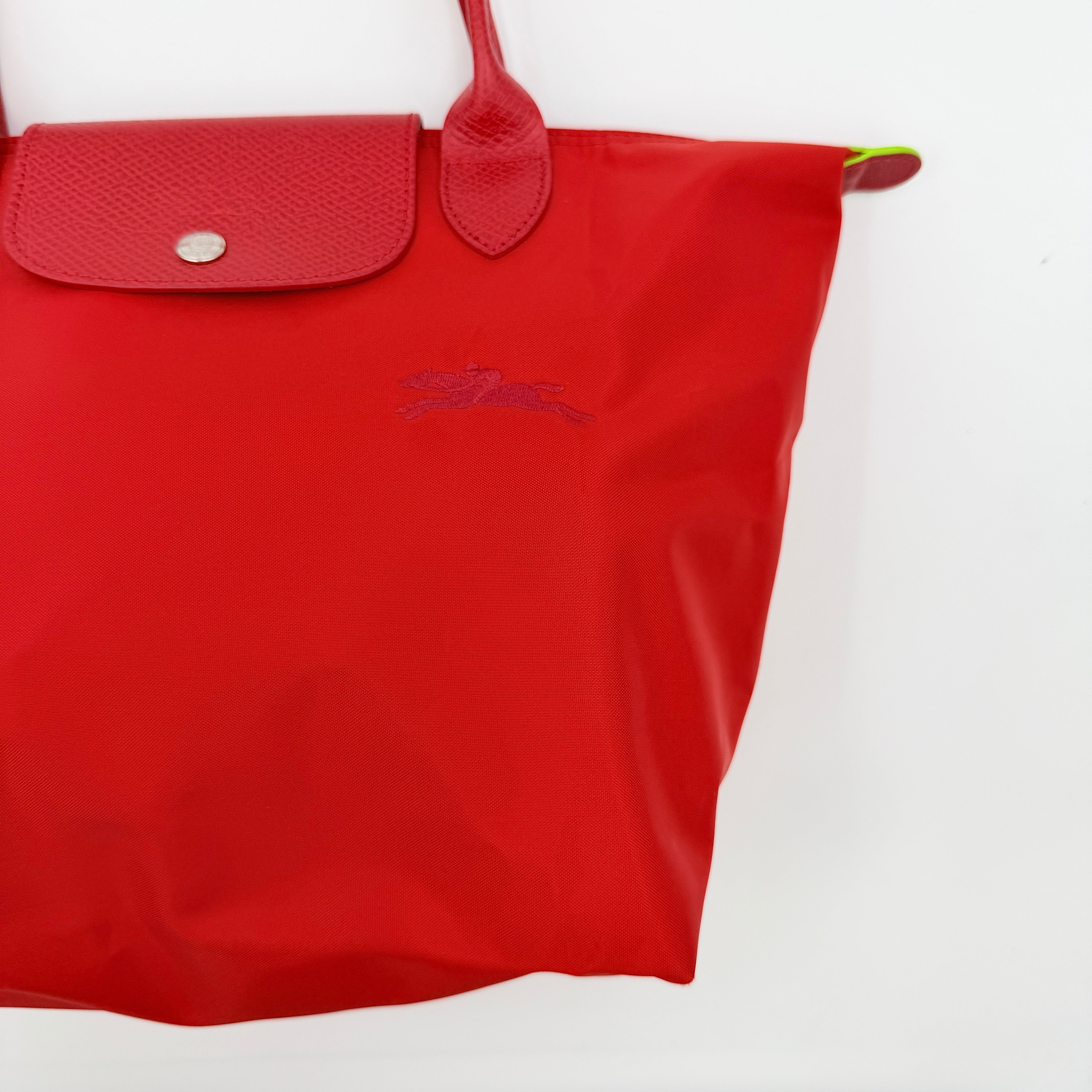Longchamp Le Pliage Club tote bag in red nylon with tonal leather accents and silver hardware.