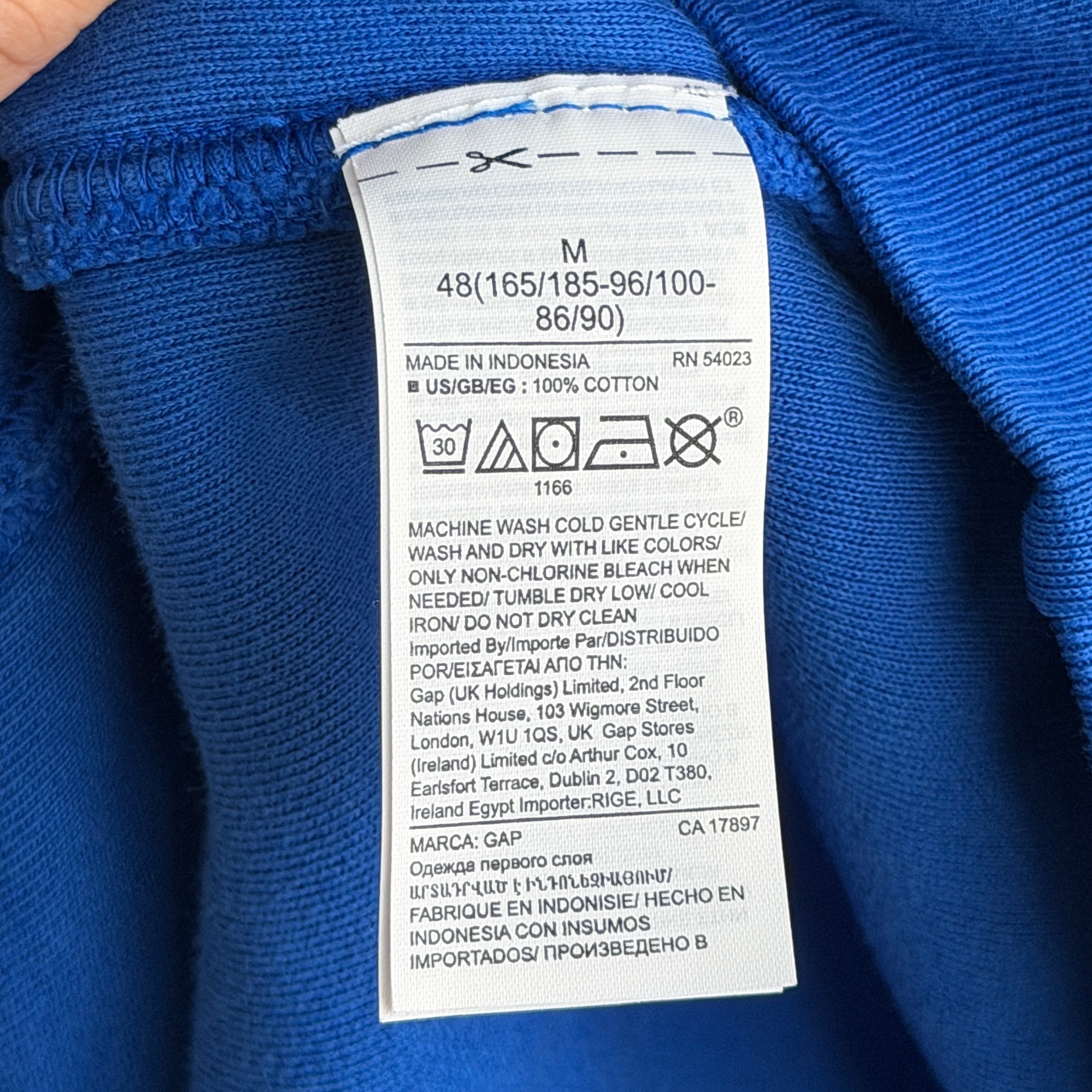 Yeezy x Gap hoodie in vivid blue with a relaxed fit and front pocket, presented by Elevated Studios.