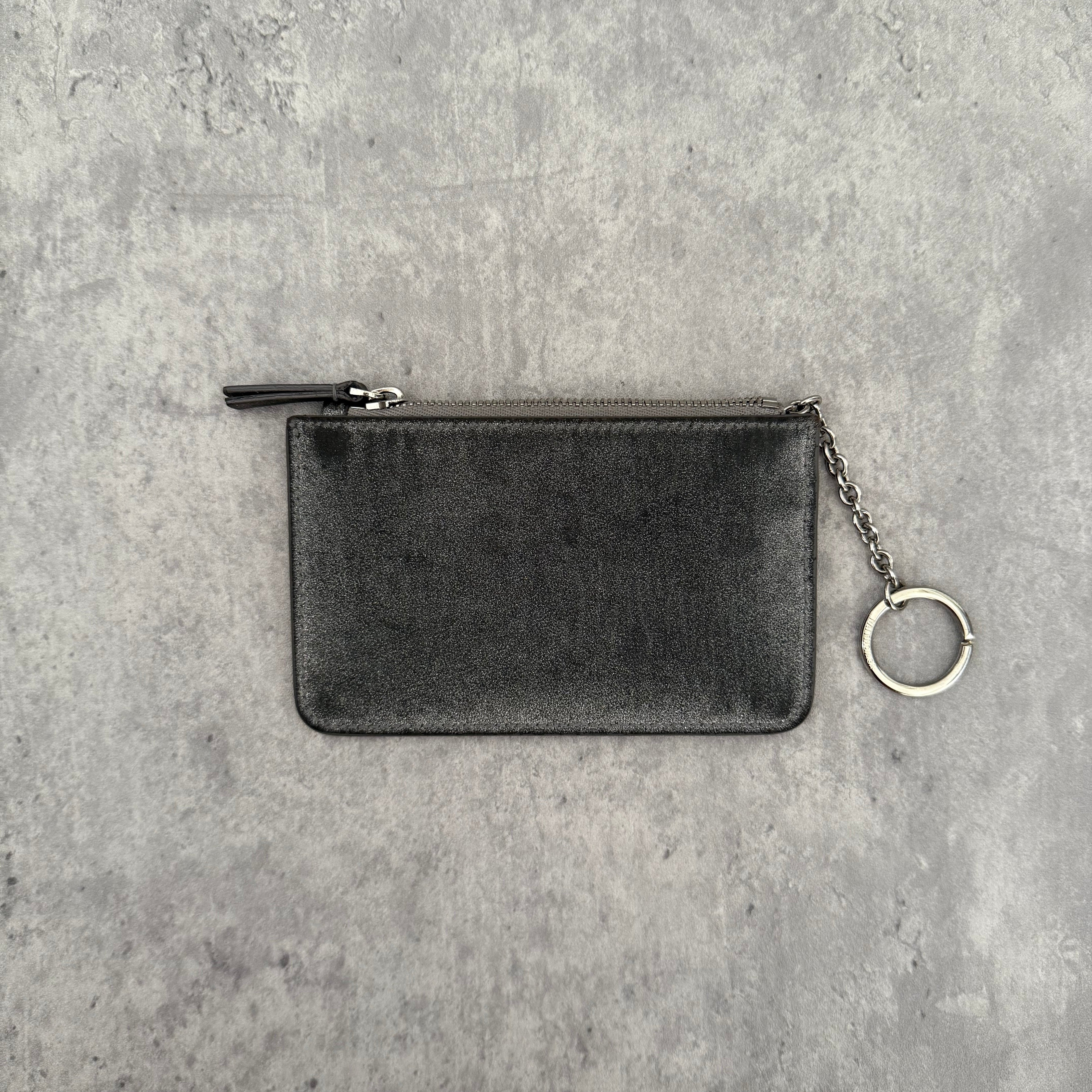 Balenciaga Graphic Print Silver Wallet, metallic silver leather with bold black logo and zip closure with keyring chain.