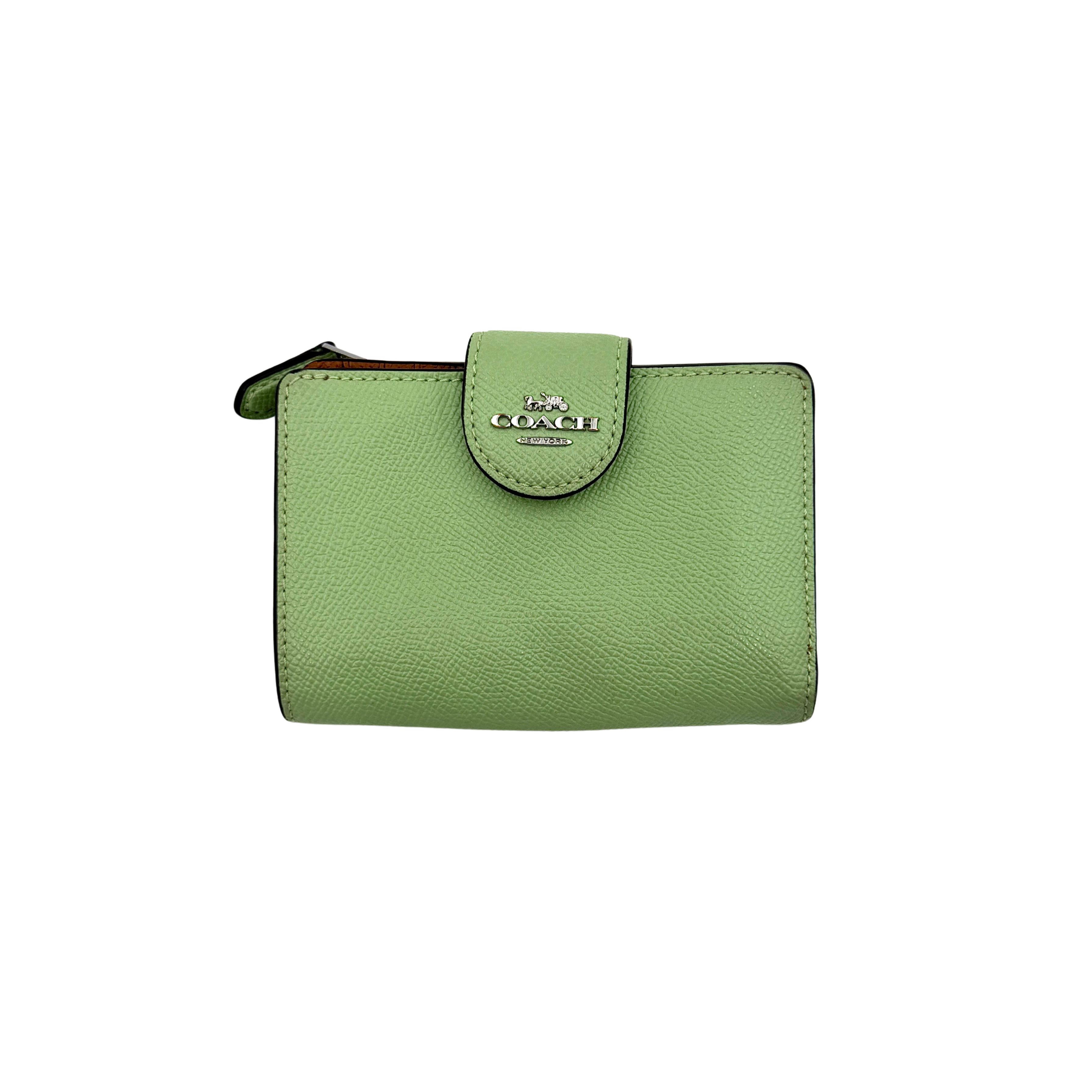 Coach Medium Corner Zip Wallet in fresh green pebbled leather with silver logo hardware and organised tan interior.