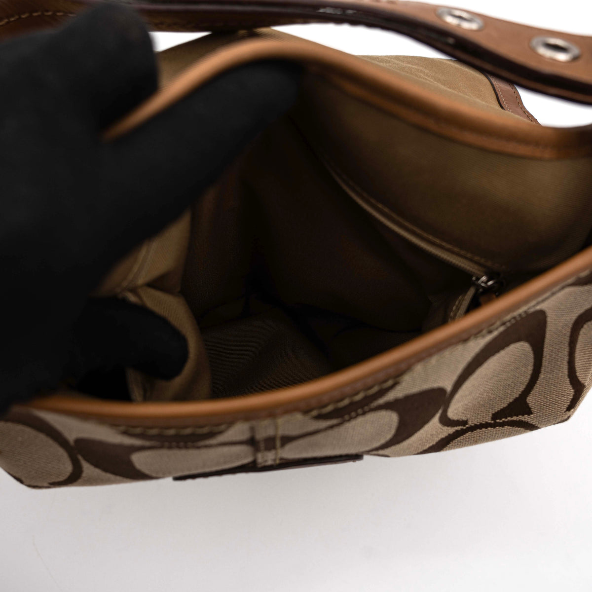 Coach 2Way Signature Soho Buckle Flap Shoulder Bag in beige and tan with silver buckle and adjustable leather strap, shown on a white background.