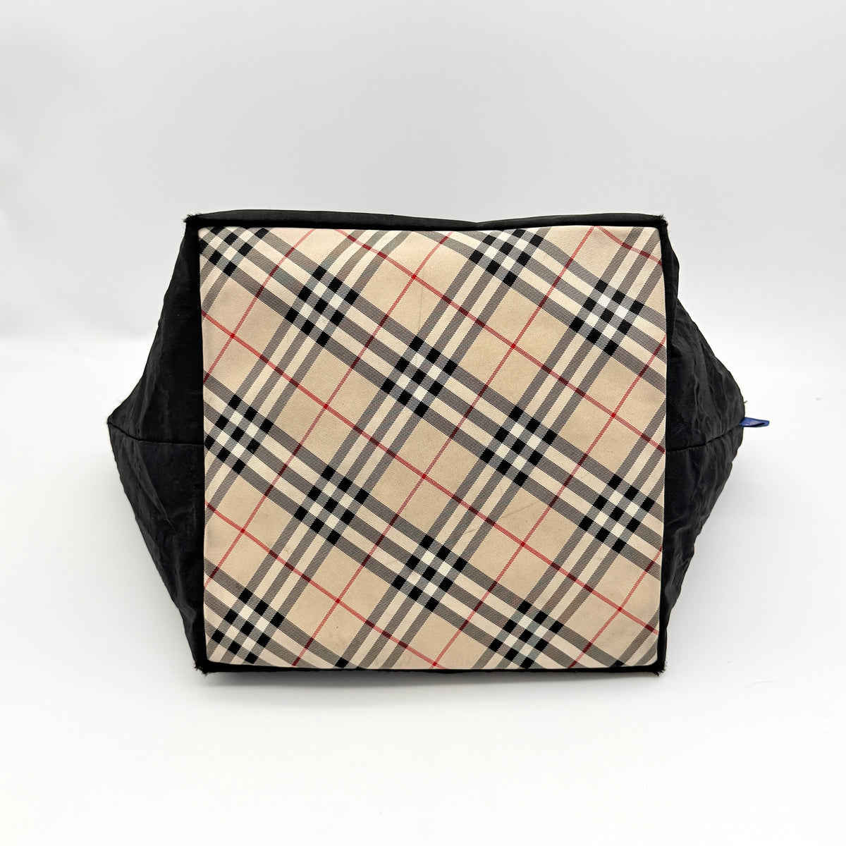Burberry Blue Label Nova Check tote bag in black nylon with beige checked base and webbed handles, shown on white background.