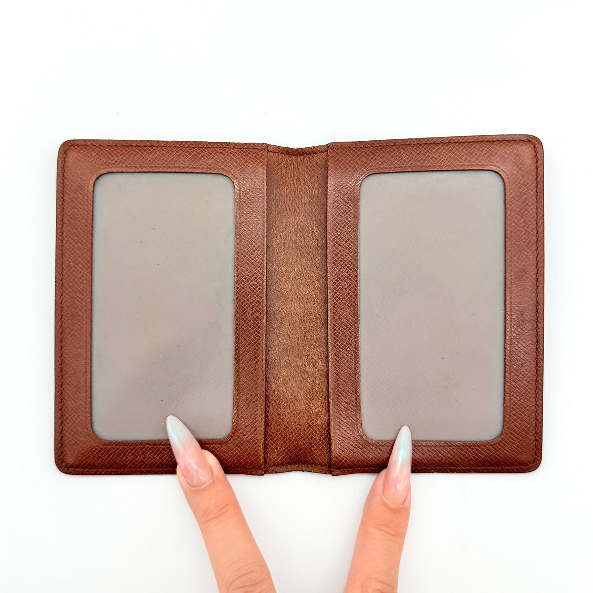 Louis Vuitton Monogram ID Card Holder in brown coated canvas with signature pattern and brown leather interior.