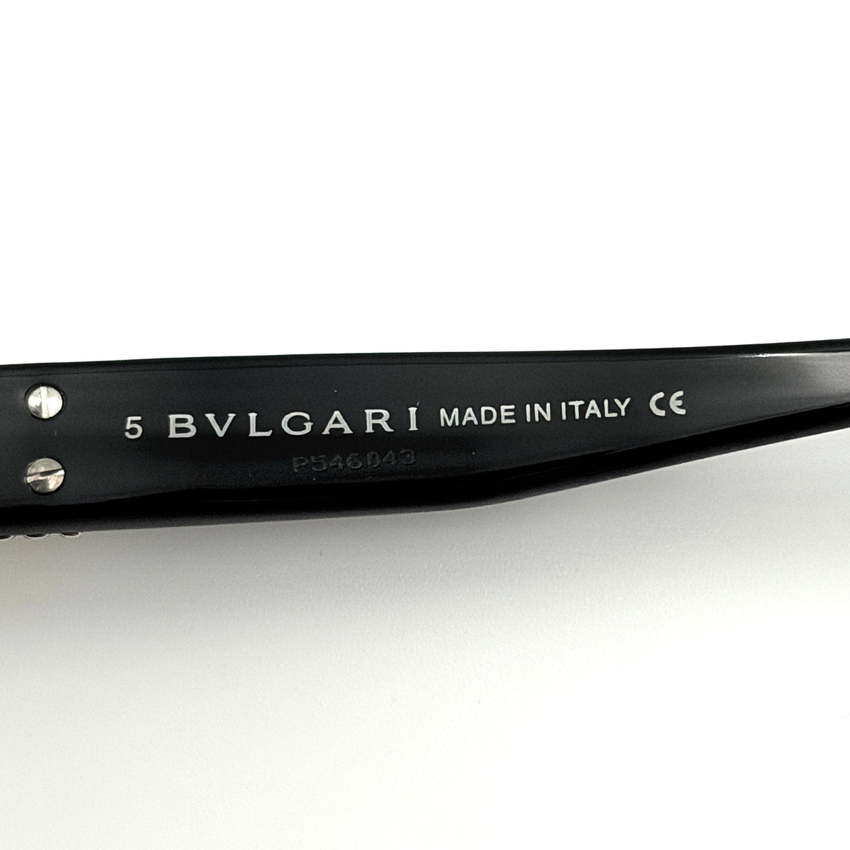 Bvlgari 829 501/11 black sunglasses with silver and gold temple hardware, displayed with case and cleaning cloth.