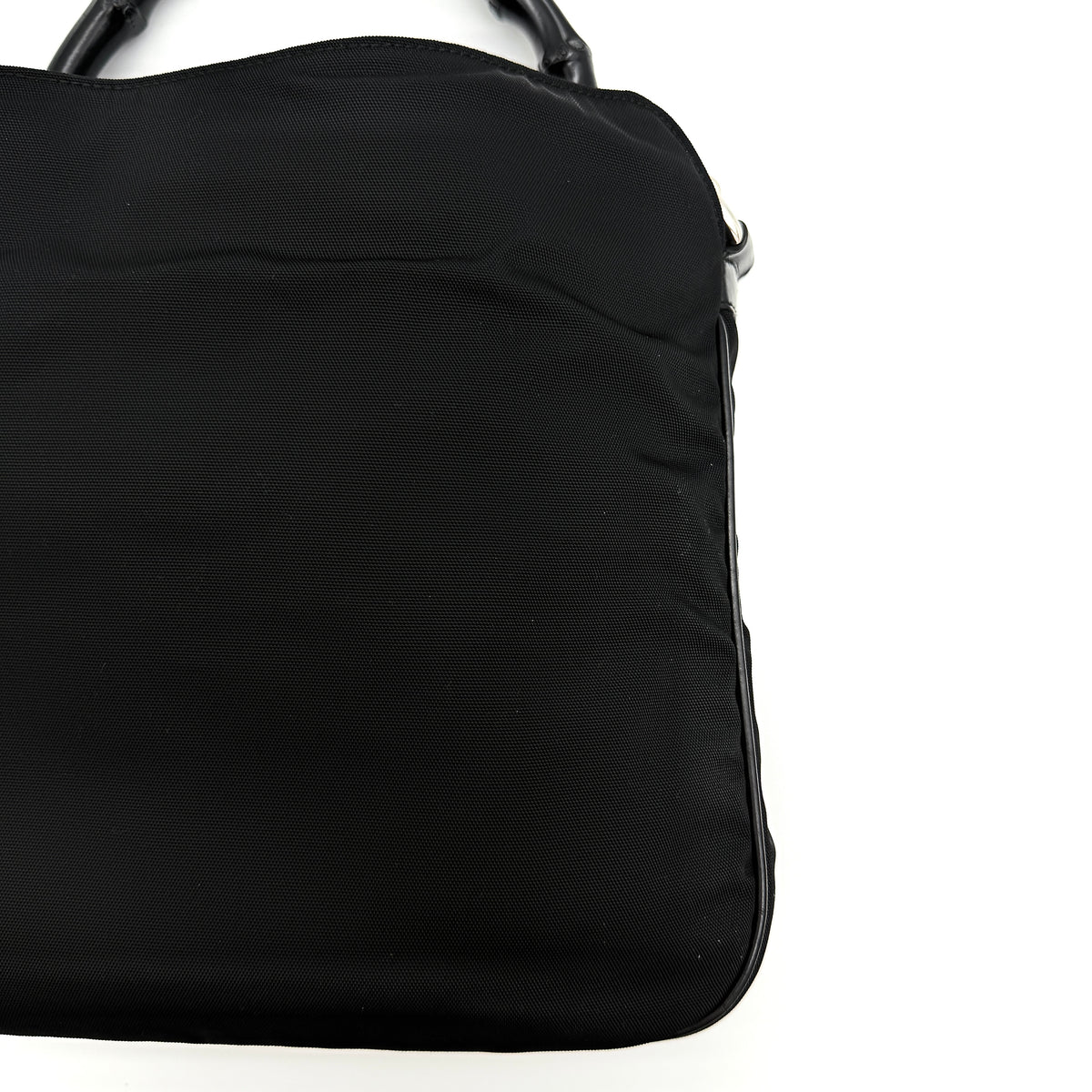 Gucci black nylon shoulder bag with bamboo handle and detachable strap shown with dust bag.