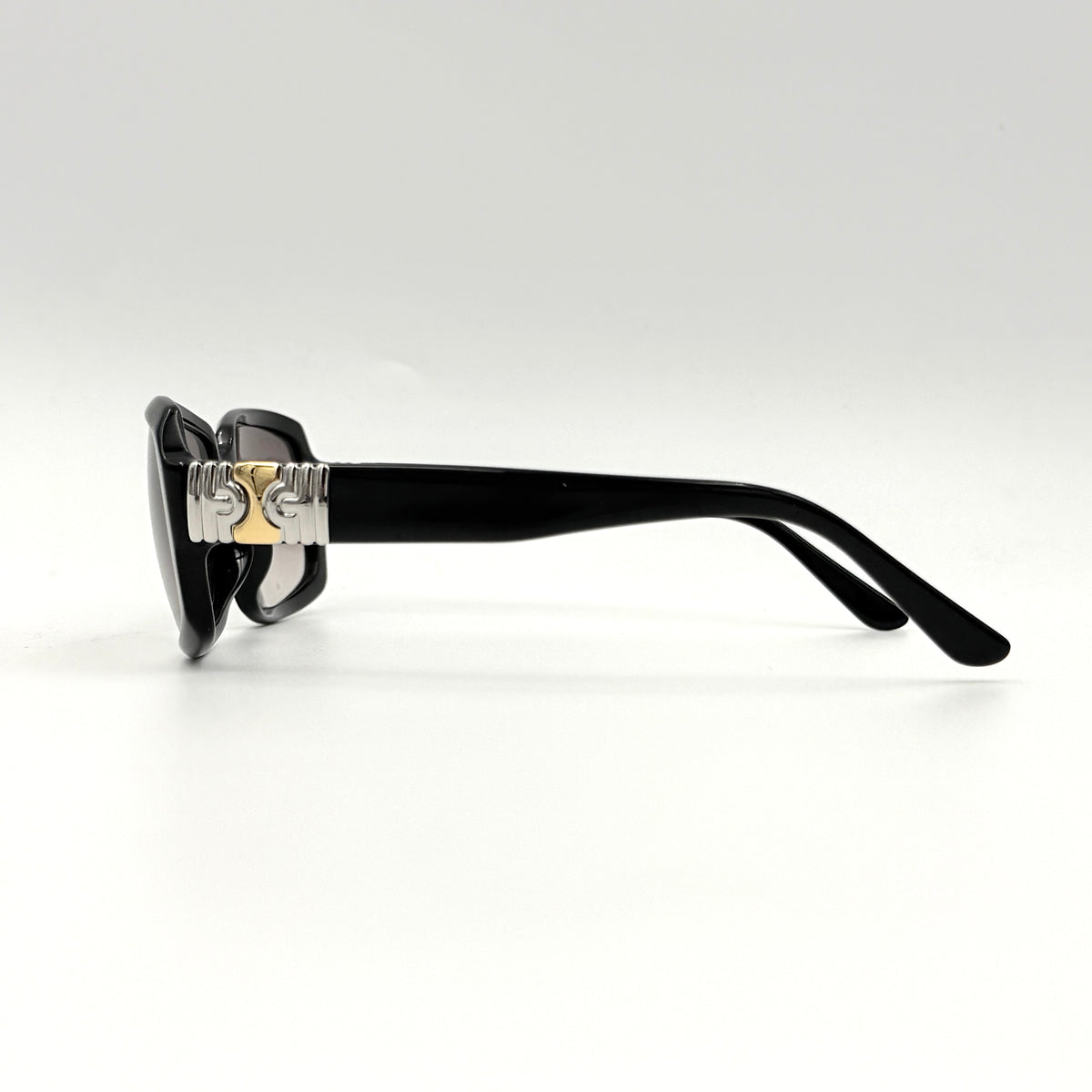 Bvlgari 829 501/11 black sunglasses with silver and gold temple hardware, displayed with case and cleaning cloth.